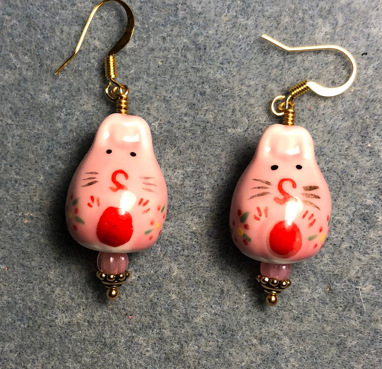 Pink and red ceramic bunny rabbit bead earrings adorned with pink Czech glass beads.
