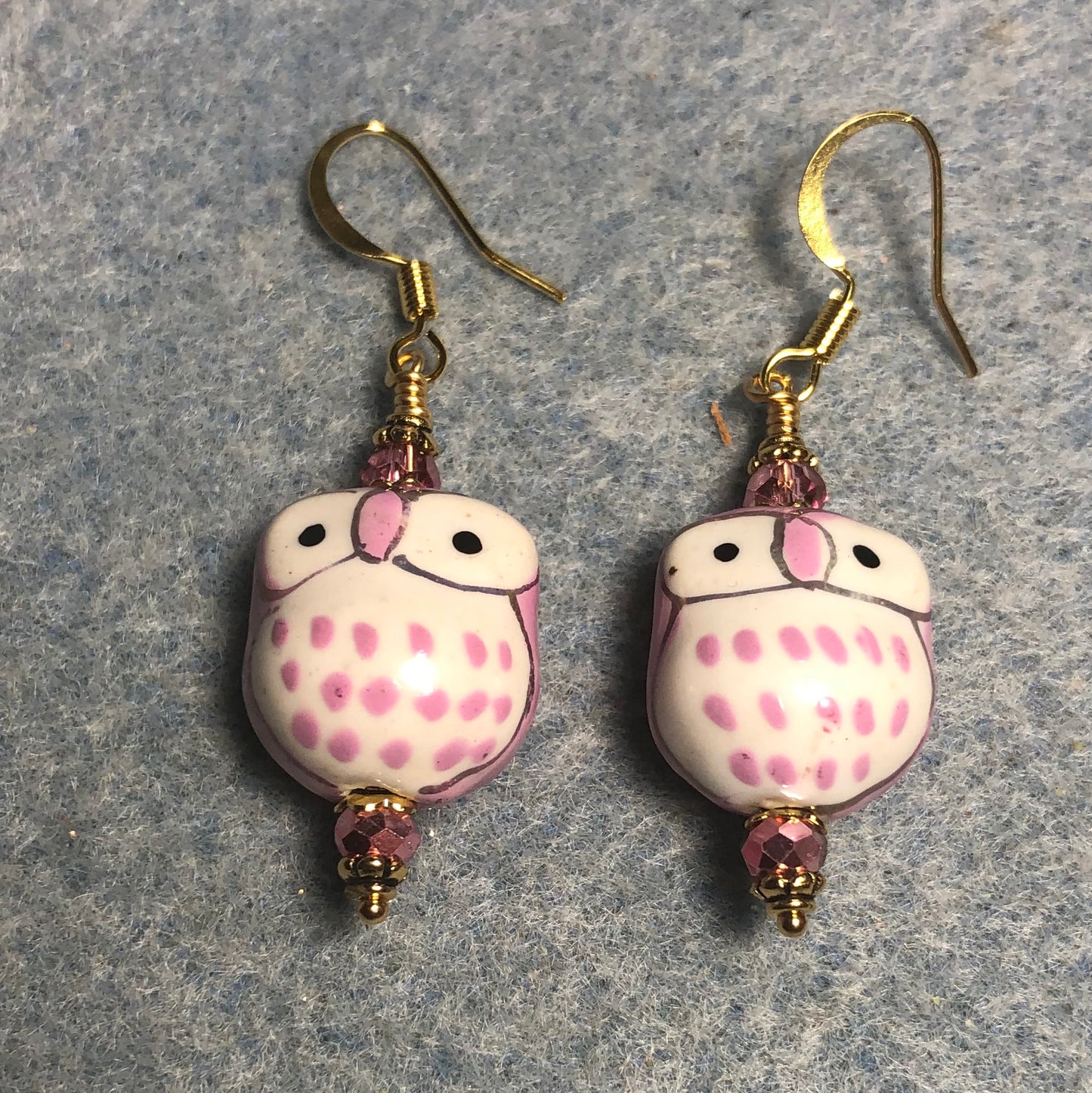 Pink ceramic spotted owl bead earrings adorned with sparkly pink Chinese crystal beads.