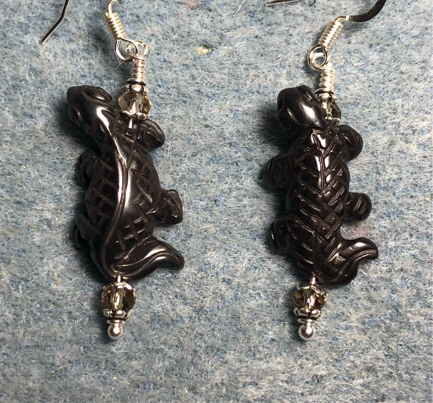 Gray hematite lizard bead earrings adorned with clear Chinese crystal beads.