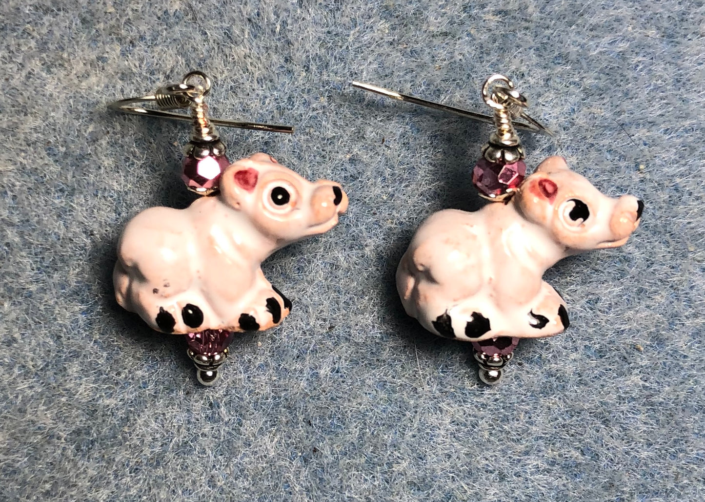 Small white and pink ceramic pig bead earrings adorned with small pink Chinese crystal beads.