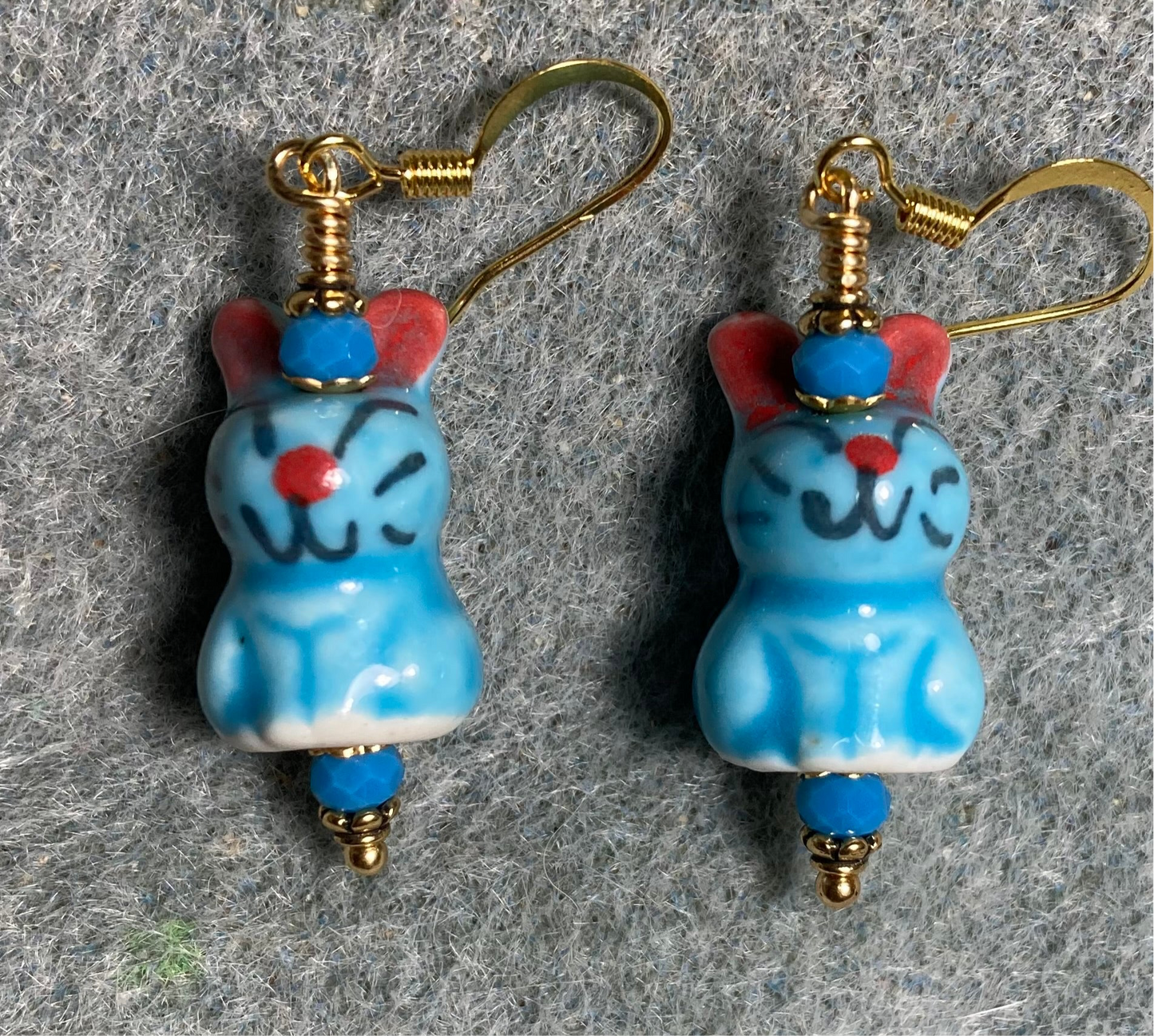 Turquoise and red ceramic bunny rabbit bead earrings adorned with turquoise Chinese crystal beads.