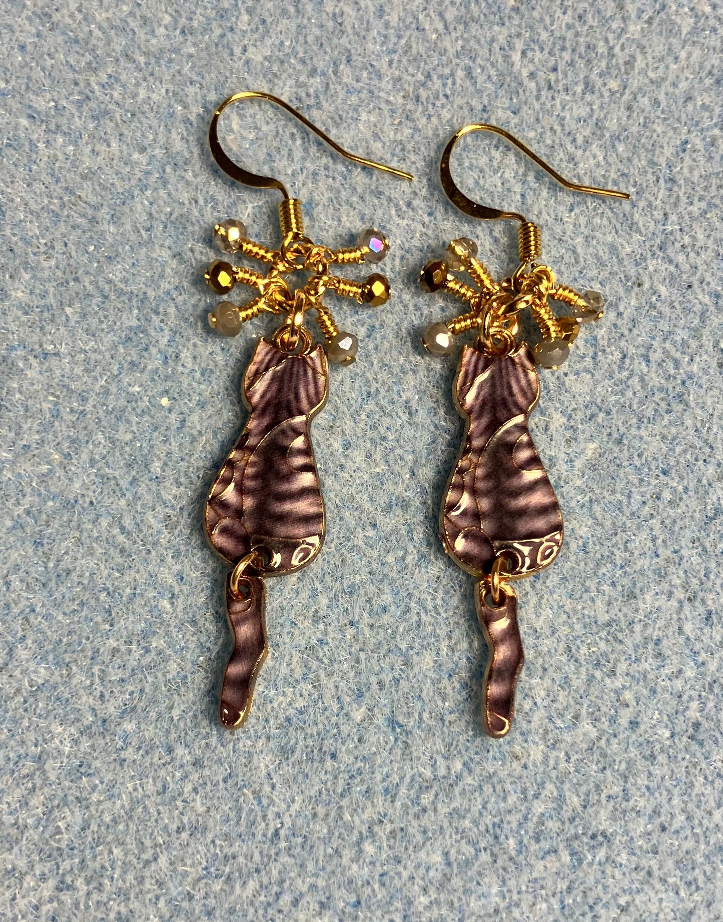 Brown and gold enamel tabby cat charm earrings adorned with tiny dangling brown, tan, and gold Chinese crystal beads.