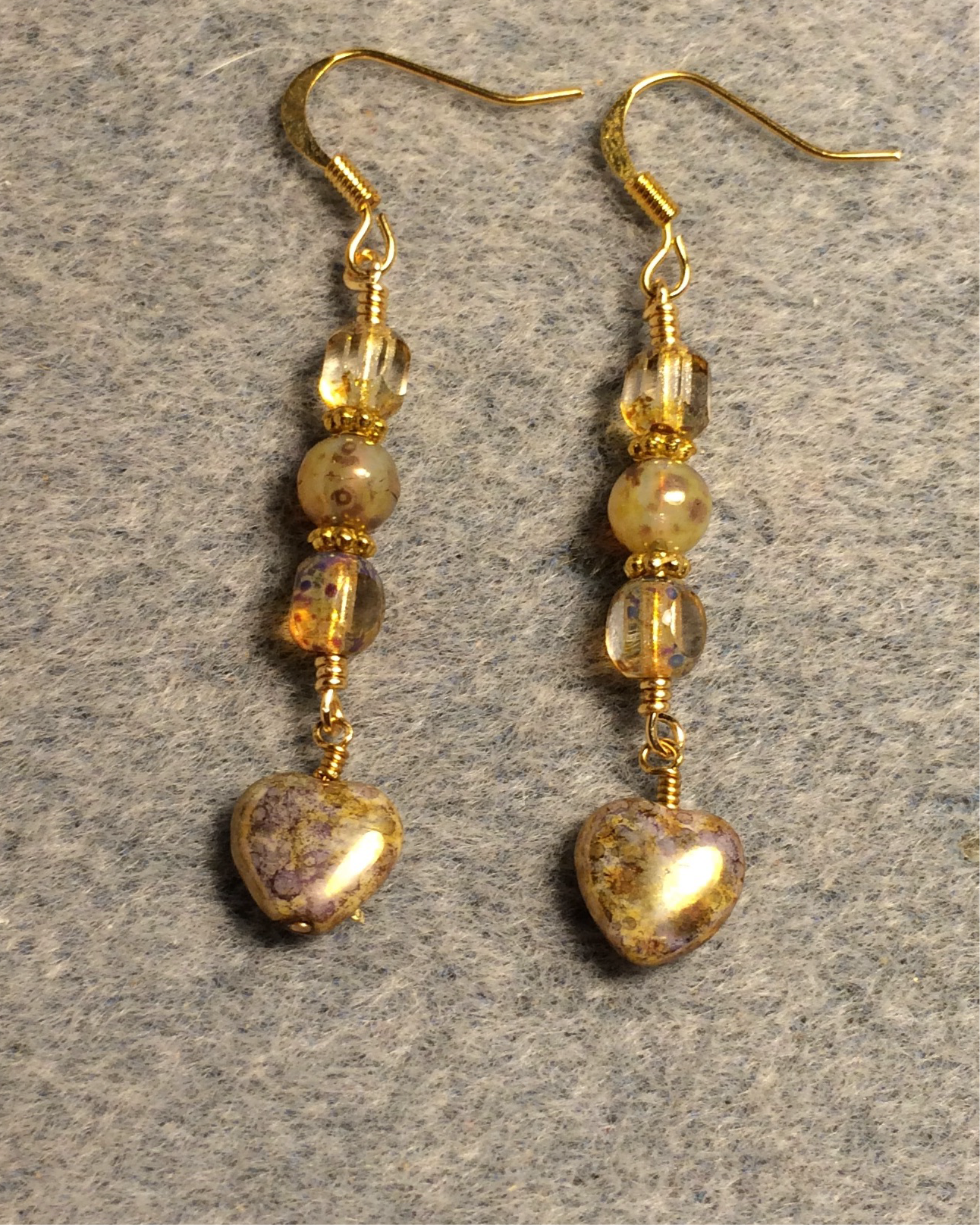 Small amber Picasso Czech glass heart bead earrings adorned with amber Picasso Czech glass beads.
