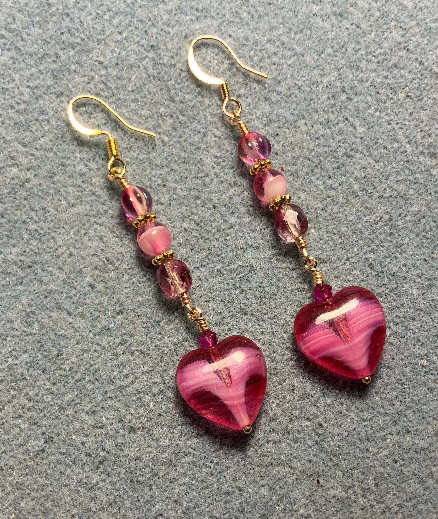 Bright pink Czech glass heart bead earrings adorned with bright pink Czech glass beads.