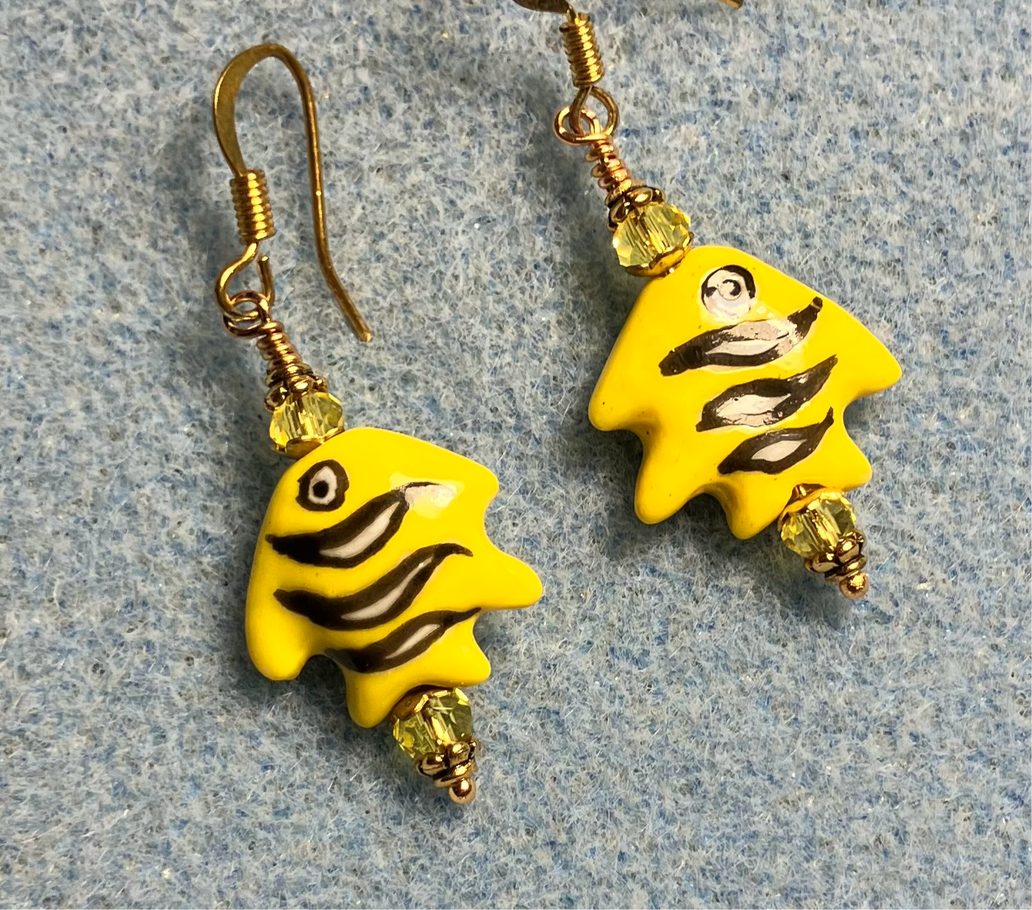 Small yellow and black ceramic fish bead earrings adorned with yellow Chinese crystal beads.