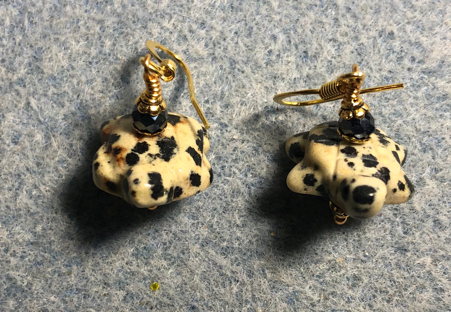 Dalmatian jasper gemstone turtle bead earrings adorned with black Chinese crystal beads.
