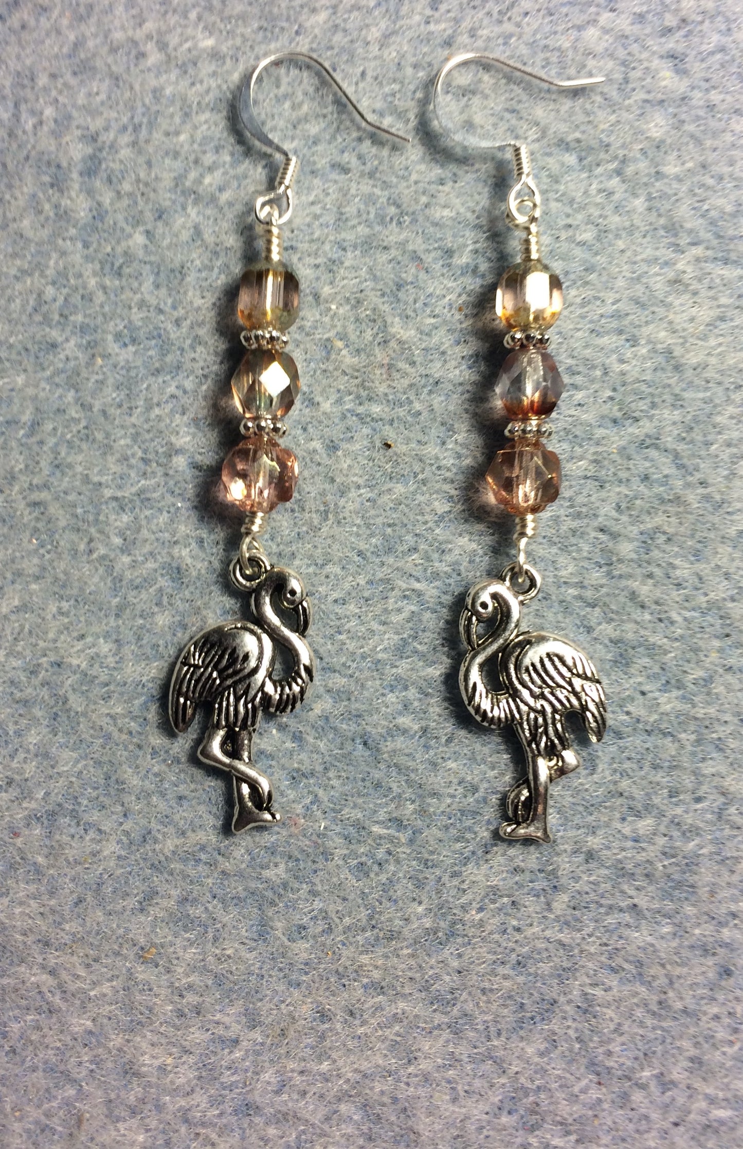 Silver flamingo charm earrings adorned with rose gold Czech glass beads