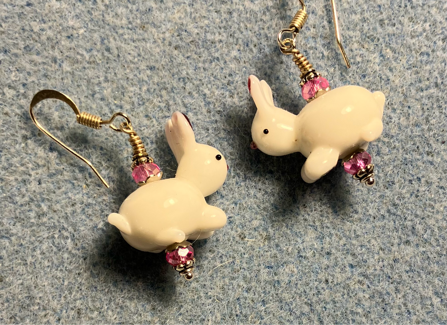 White and pink lamp work bunny rabbit bead earrings adorned with pink Chinese crystal beads.