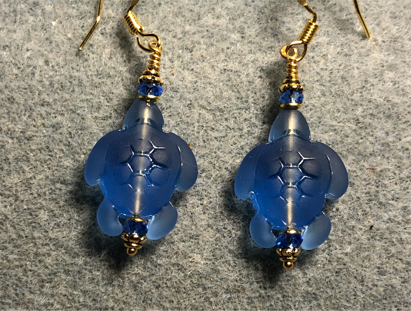 Blue sea glass sea turtle bead earrings adorned with blue Chinese crystal beads.