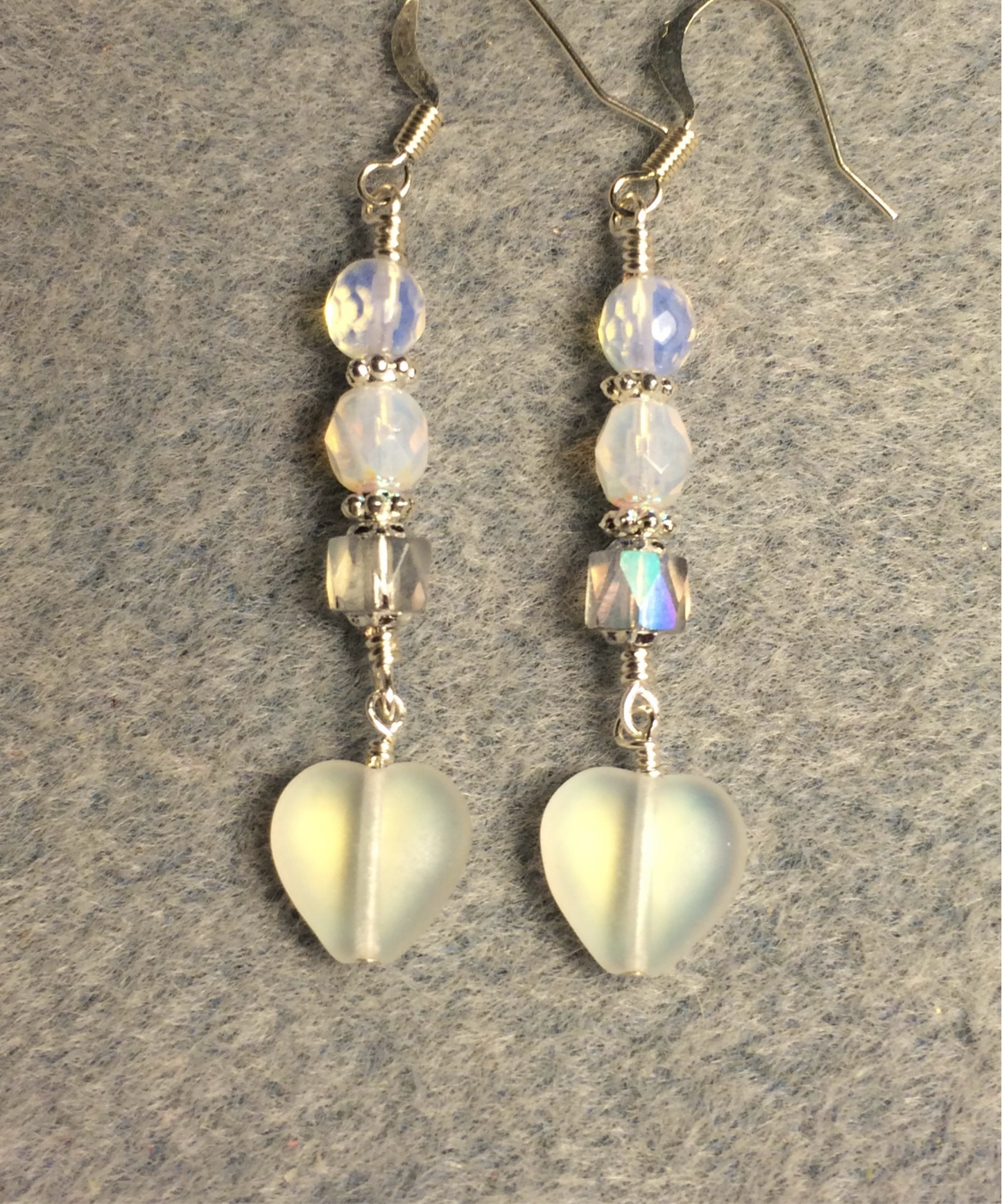 Small matte white Czech glass heart bead earrings adorned with milky white and clear Czech glass beads.