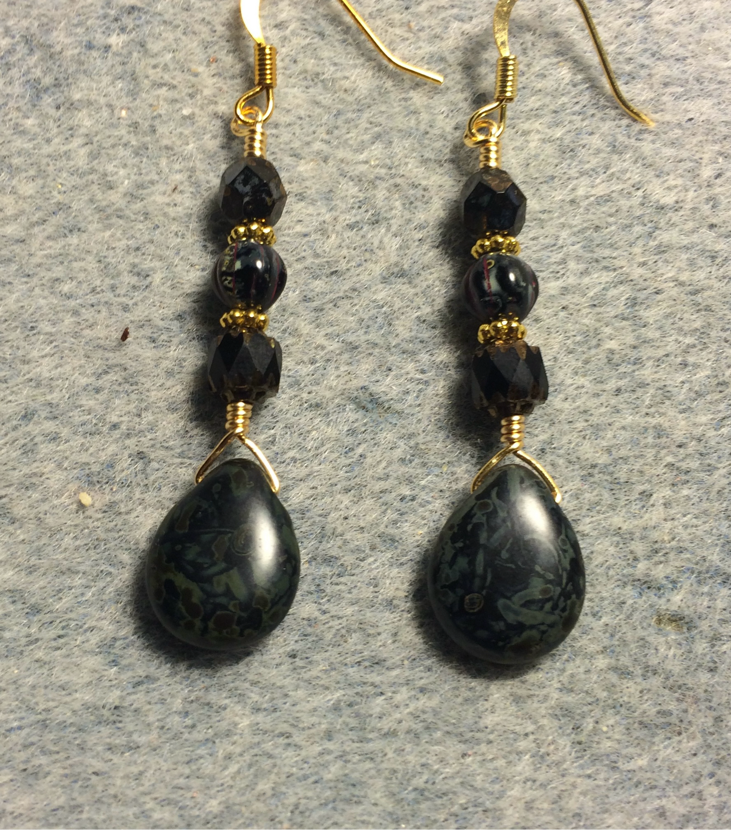 Black Picasso Czech glass pear drop bead earrings adorned with black Picasso Czech glass beads.