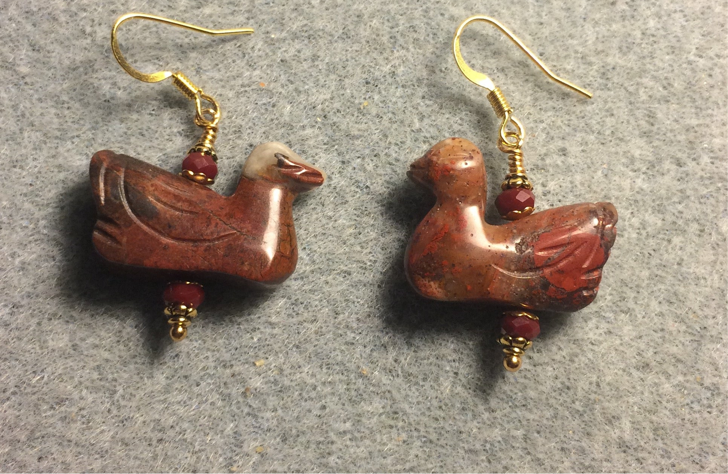 Red brecciated jasper gemstone duck bead earrings adorned with dark red Chinese crystal beads.