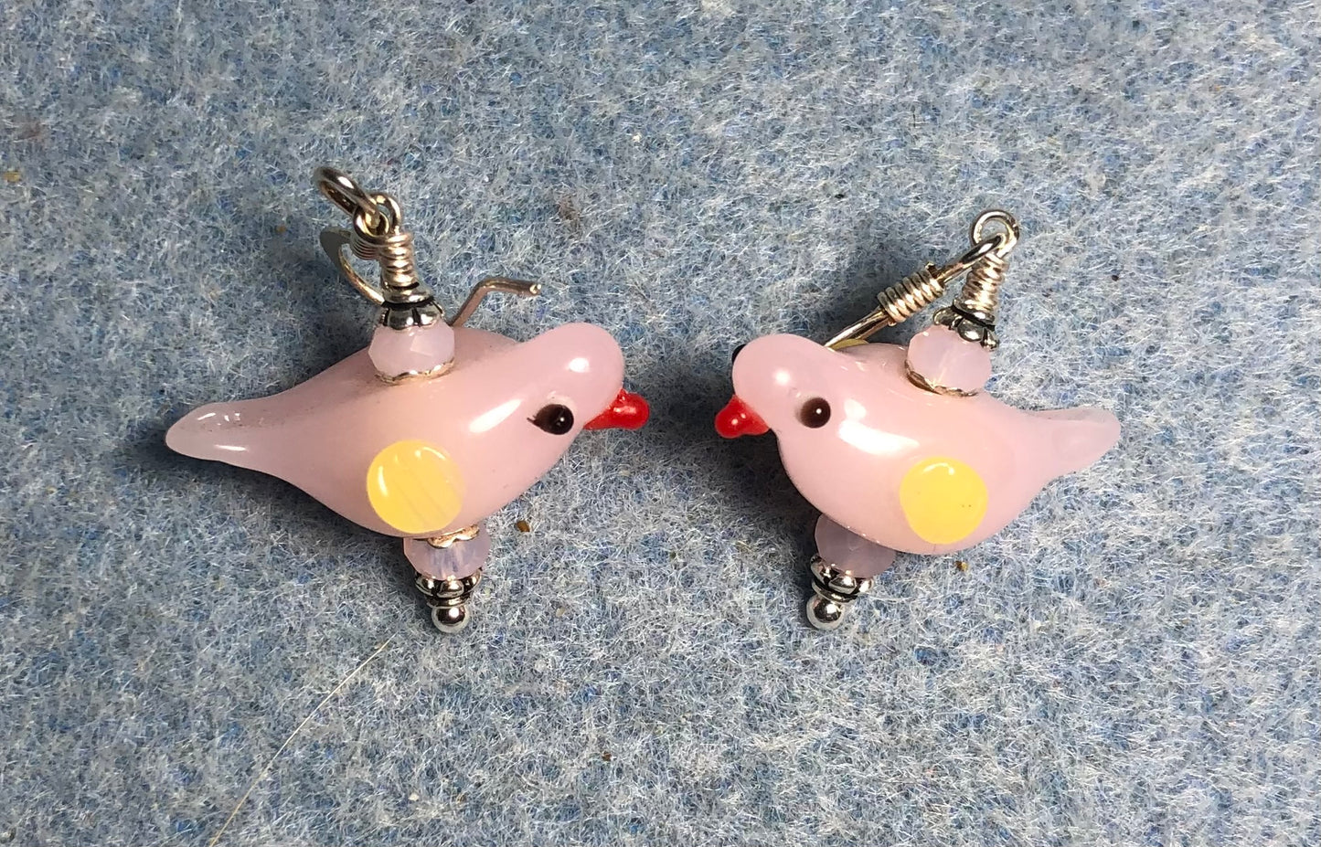 Milky pink lamp work songbird bead earrings adorned with pink Chinese crystal beads.