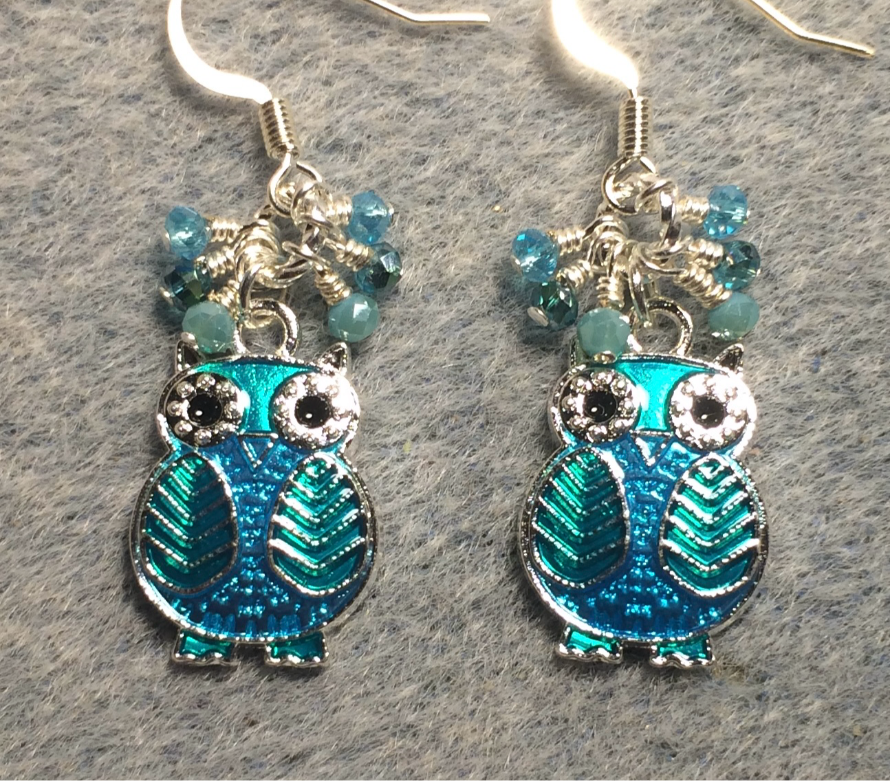 Turquoise and aqua enamel owl charm earrings adorned with tiny dangling turquoise and aqua Chinese crystal beads.