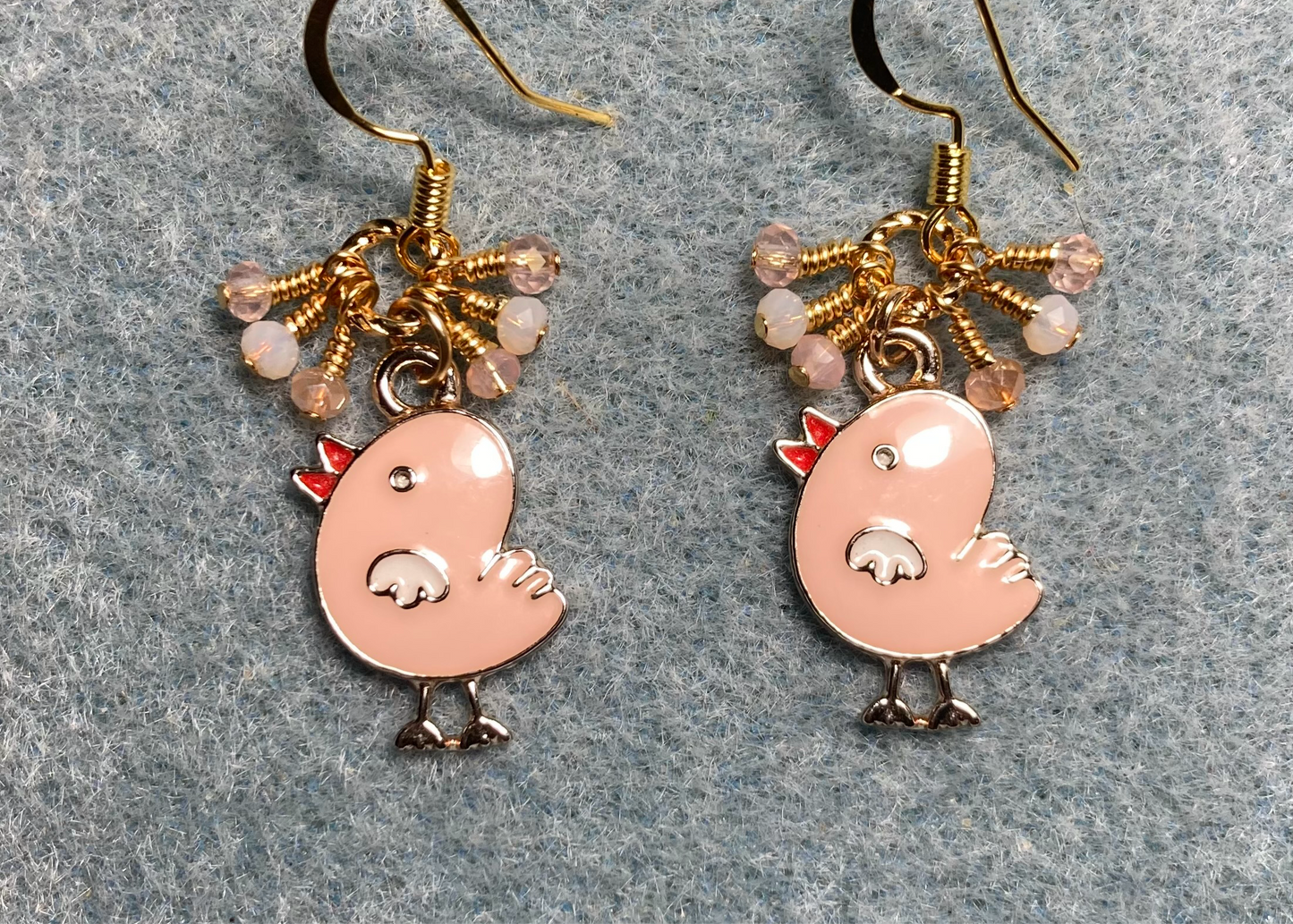 Small peach and white enamel chick charm earrings adorned with tiny dangling peach and white Chinese crystal beads.