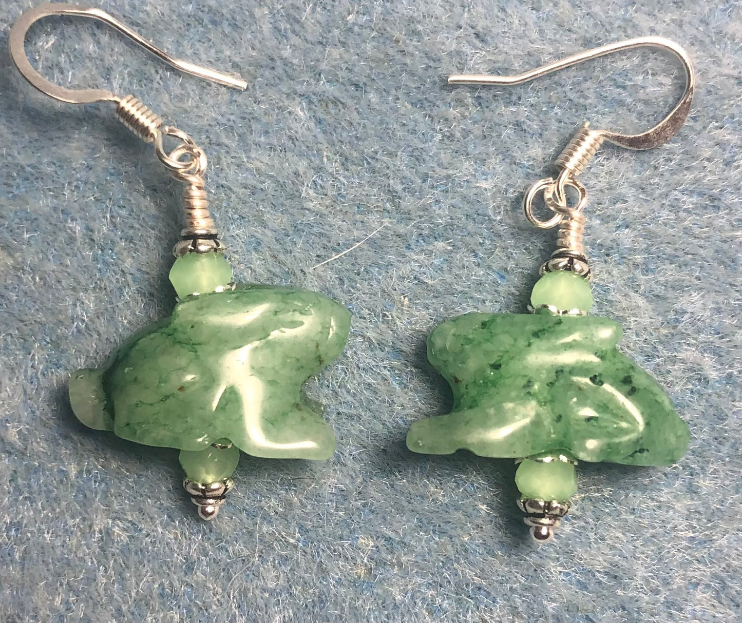 Green aventurine gemstone rabbit bead earrings adorned with light green Chinese crystal beads.