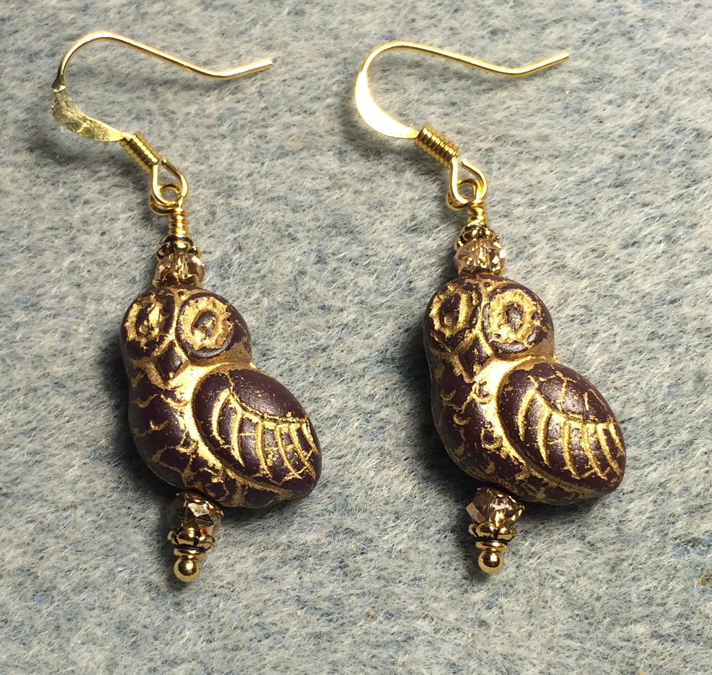 Brownish red (with gold wash) fancy Czech glass owl bead earrings adorned with gold Chinese crystal beads.
