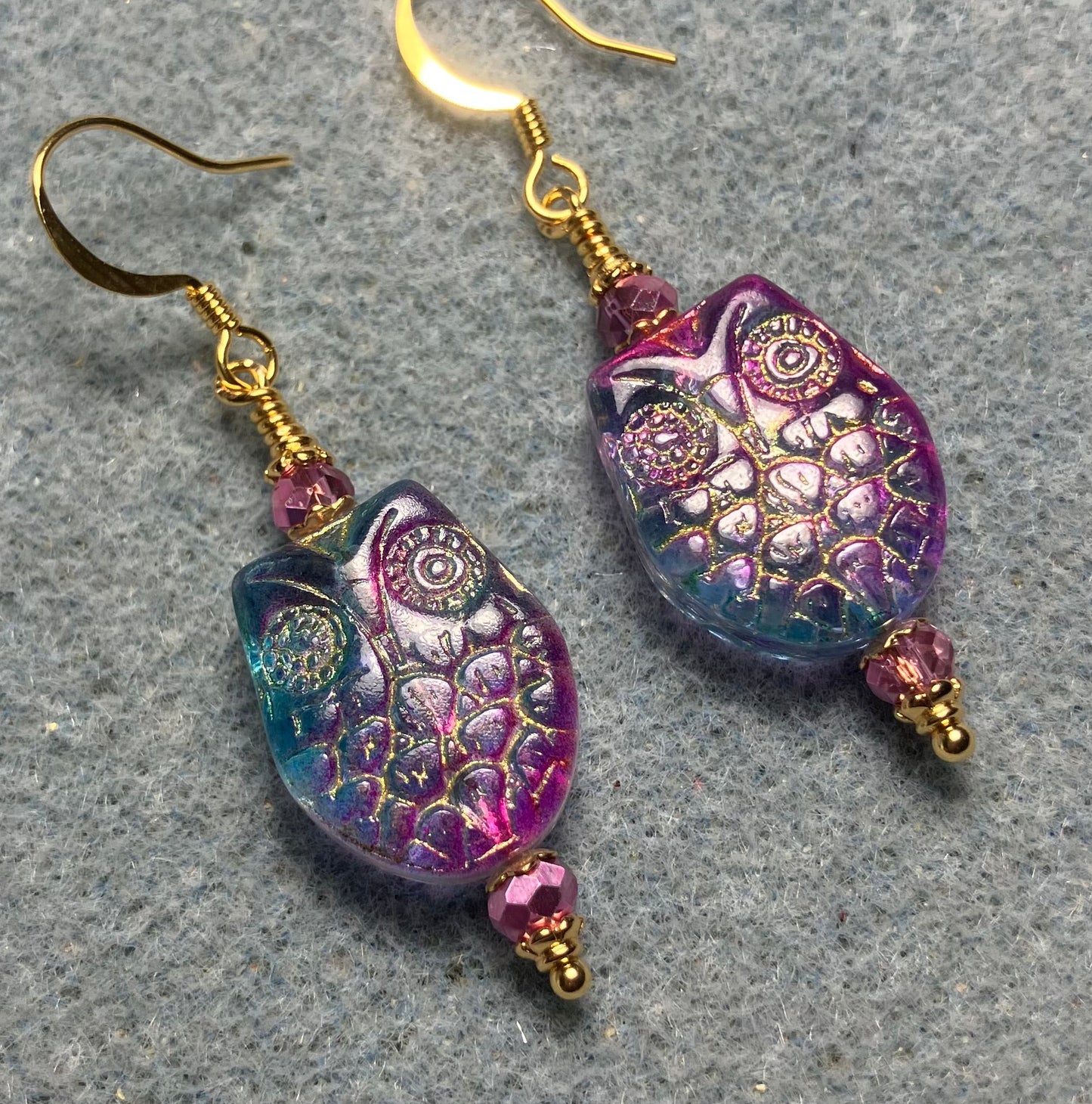 Sparkly pink and turquoise (with gold wash) Czech glass owl bead earrings adorned with pink Chinese crystal beads.