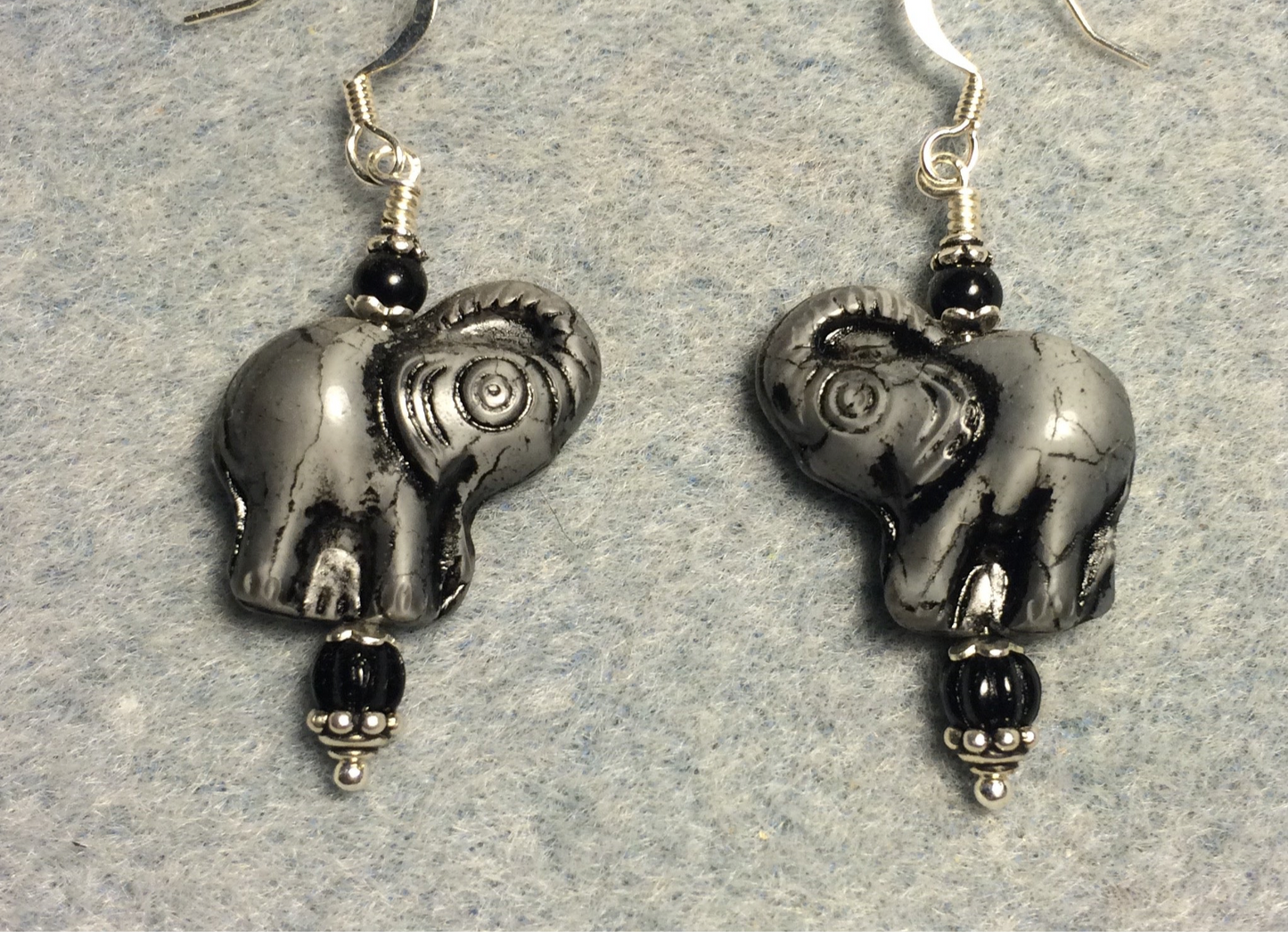 Gray (with black inlay) Czech glass elephant bead earrings adorned with black Czech glass beads.