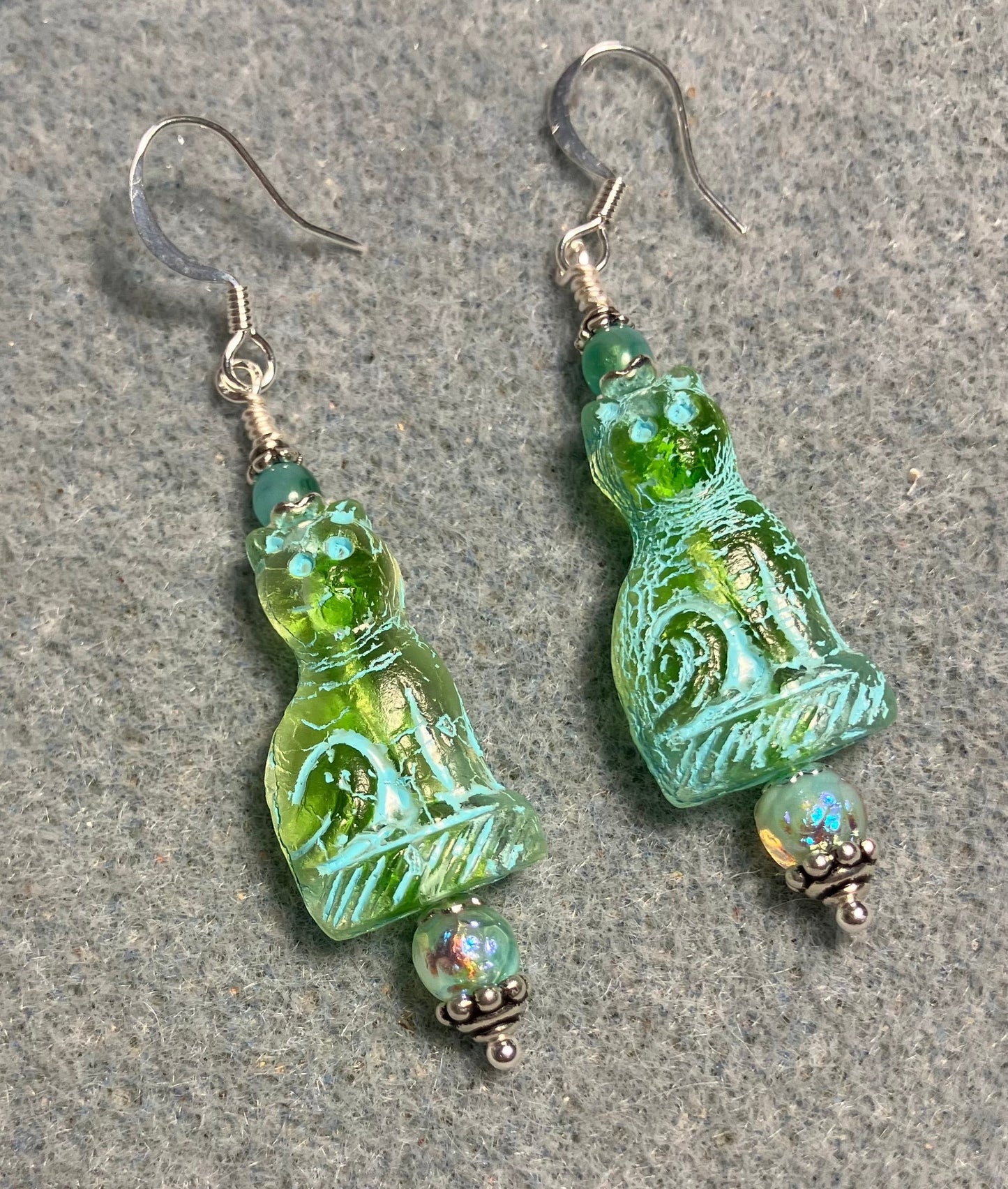 Translucent light green (with turquoise inlay) fancy Czech glass fancy cat bead earrings adorned with aqua green Czech glass beads.