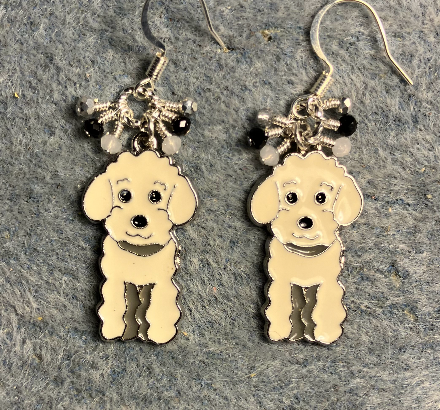 White and silver enamel poodle dog charm earrings adorned with tiny dangling white, silver, and black Chinese crystal beads.