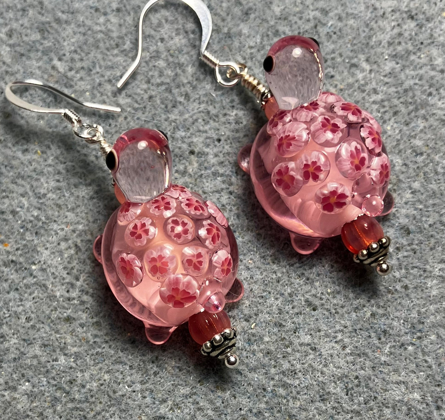 Large pink lamp work turtle bead earrings adorned with pink Czech glass beads.