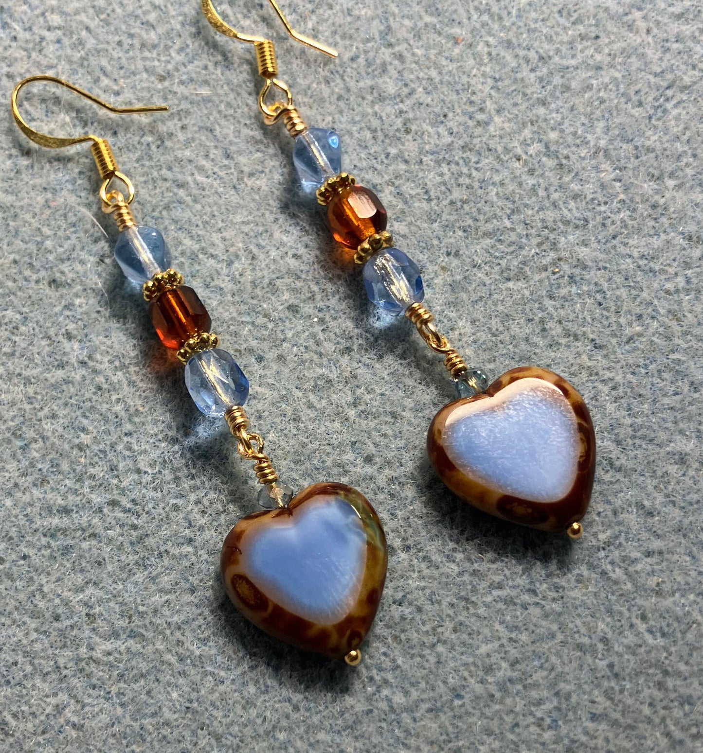 Light blue and brown Czech glass heart bead earrings adorned with light blue and brown Czech glass beads.