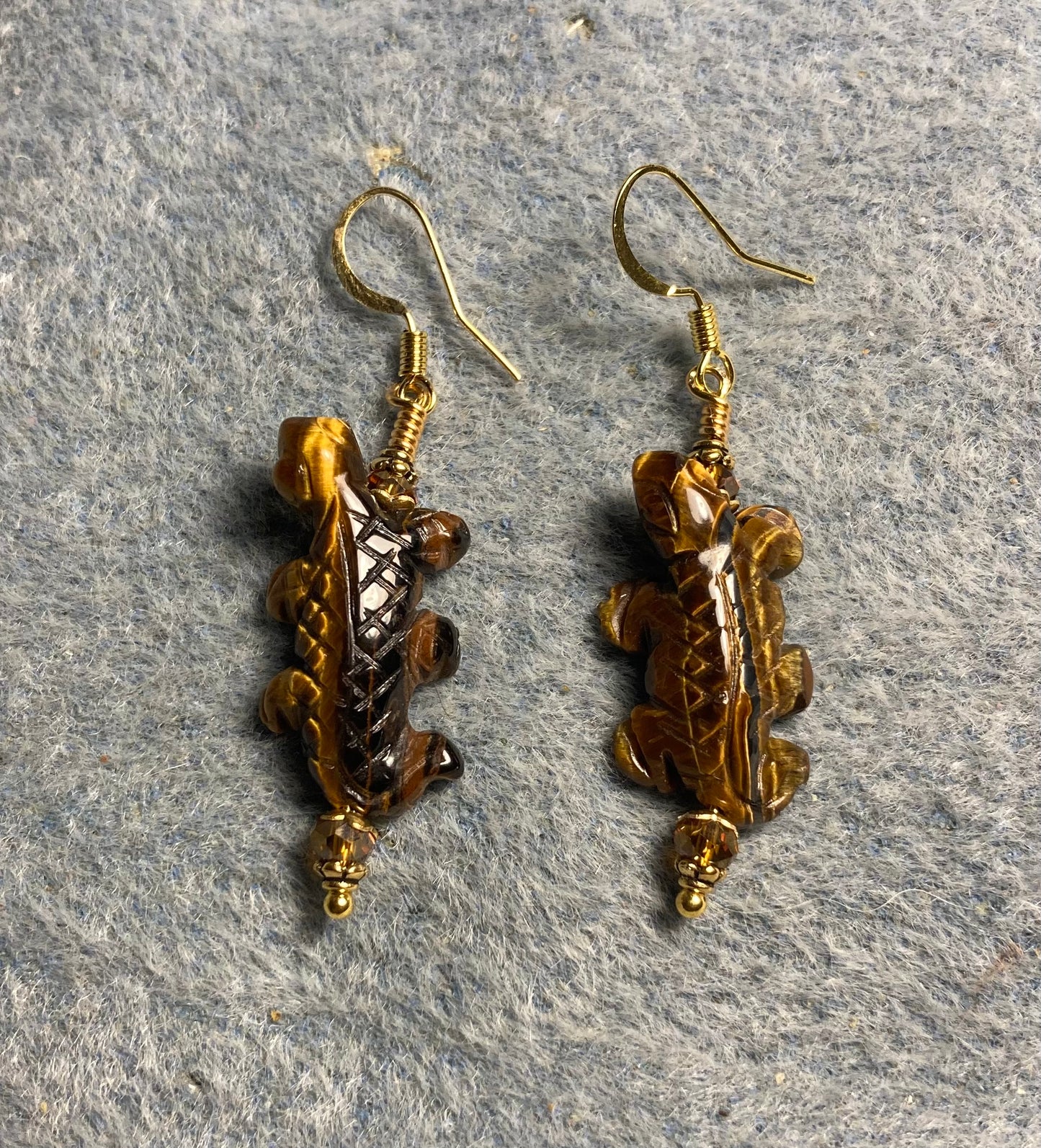 Tigereye gemstone lizard bead earrings adorned with topaz Chinese crystal beads.