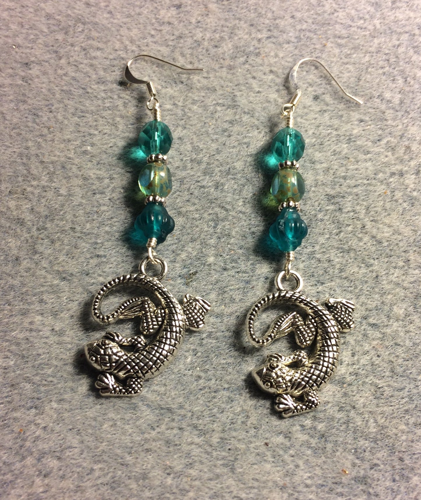 Large silver lizard charm earrings adorned with large turquoise Czech glass beads