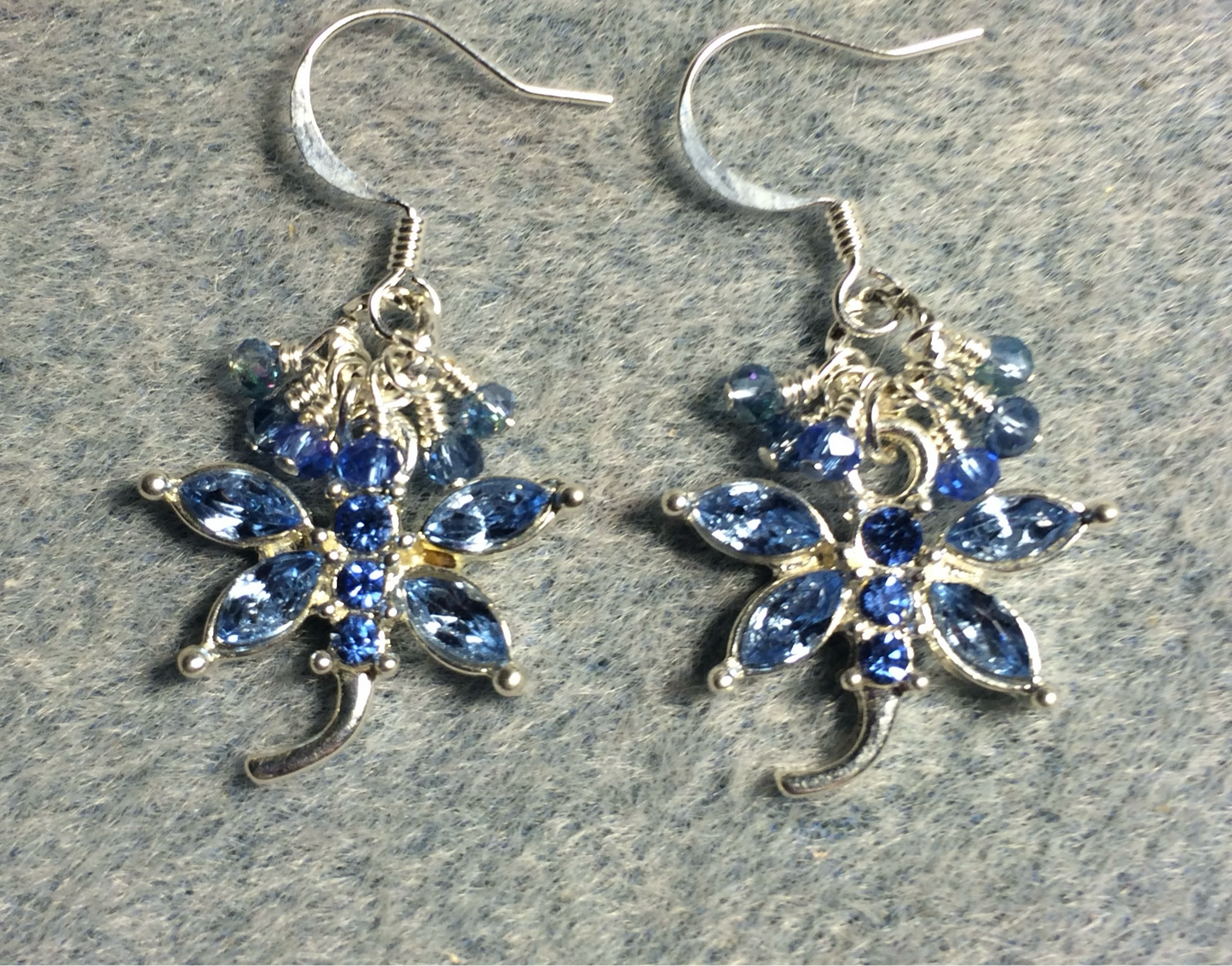 Light blue and silver rhinestone dragonfly charm earrings adorned with tiny dangling light blue and clear Chinese crystal beads.