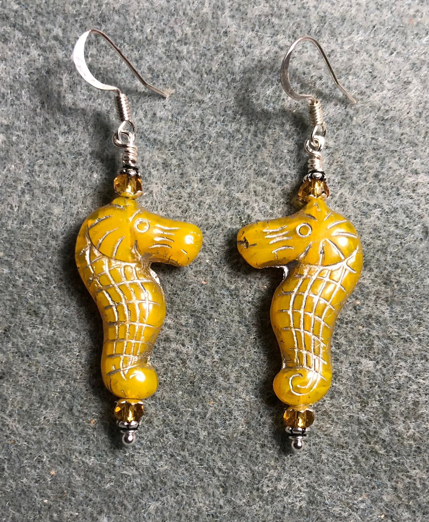 Yellow amber (with silver inlay) Czech glass seahorse bead earrings adorned with amber Chinese crystal beads.