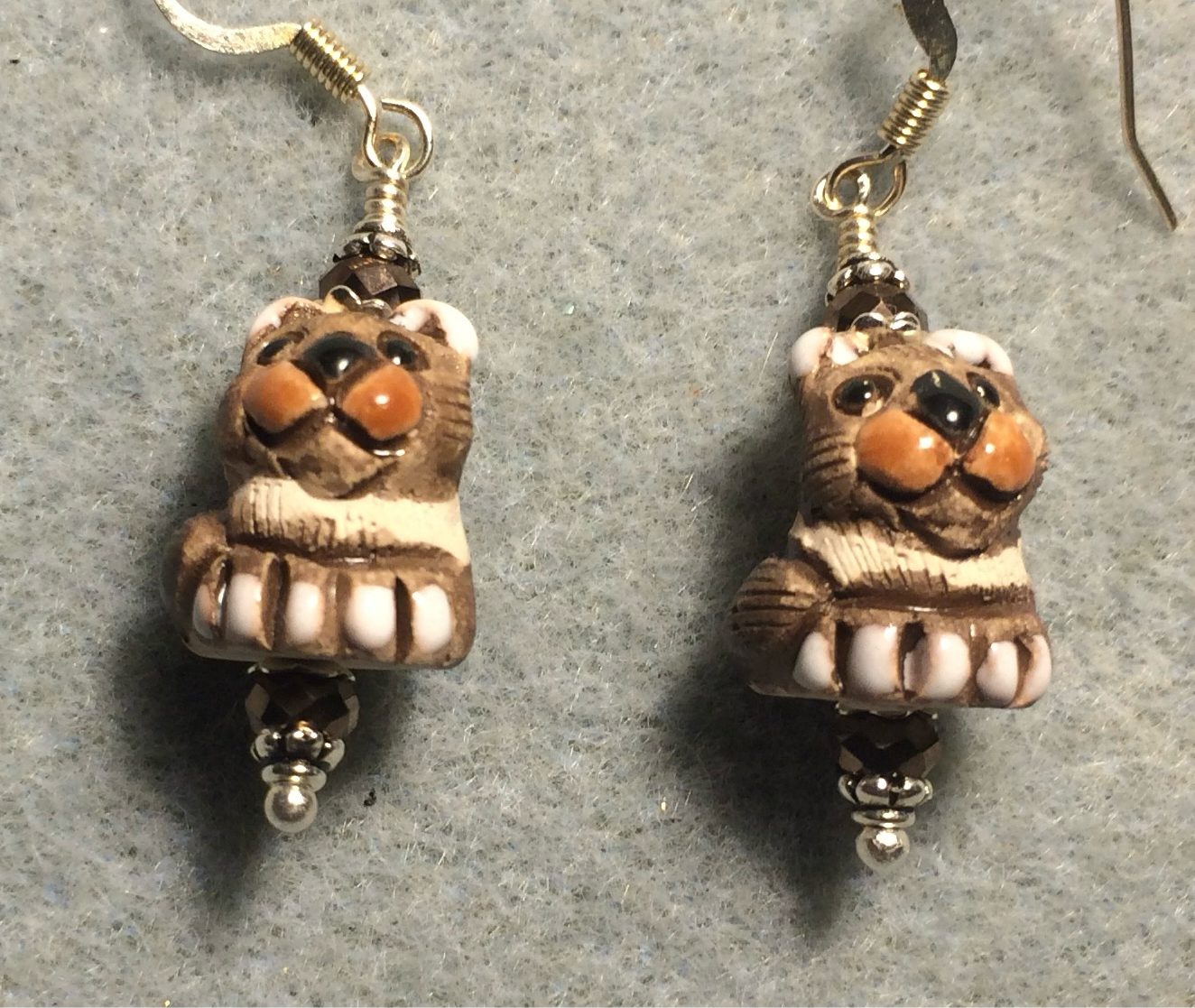 Small brown and tan ceramic exotic cat bead earrings adorned with brown Chinese crystal beads.