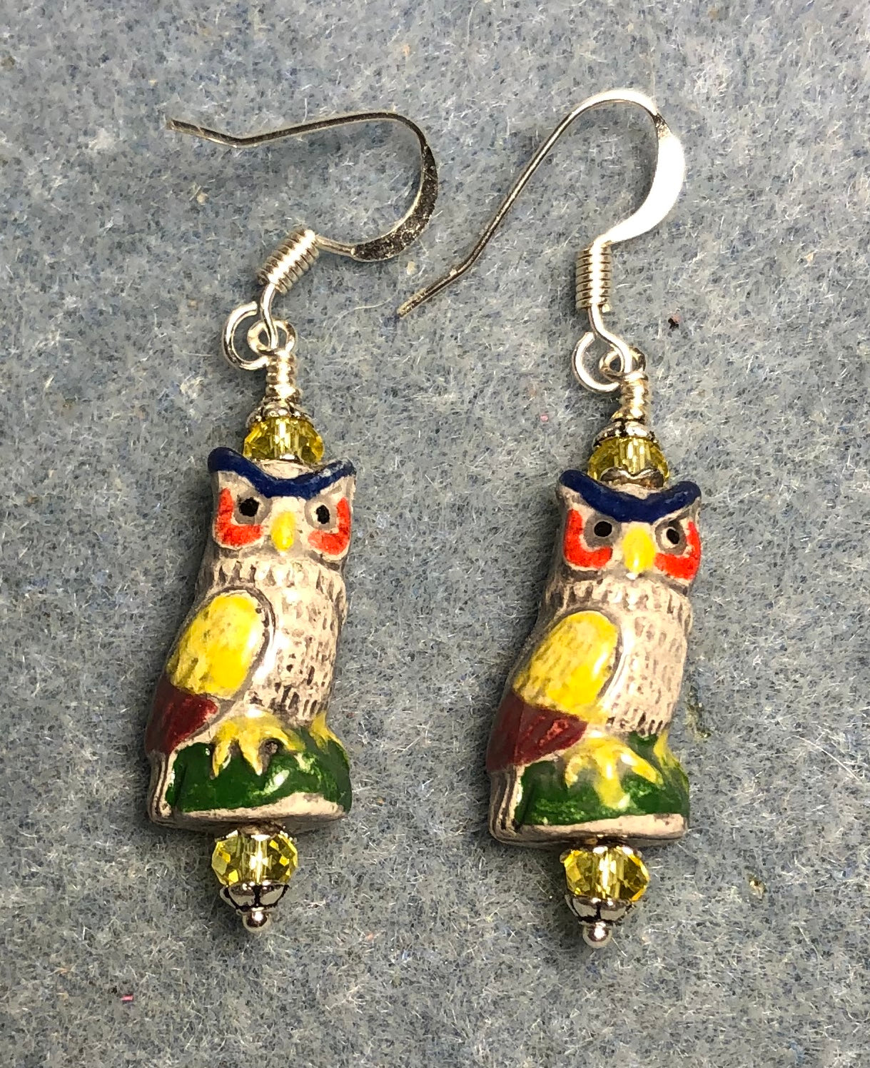 Small tan, yellow, and red ceramic owl bead earrings adorned with yellow Chinese crystal beads.