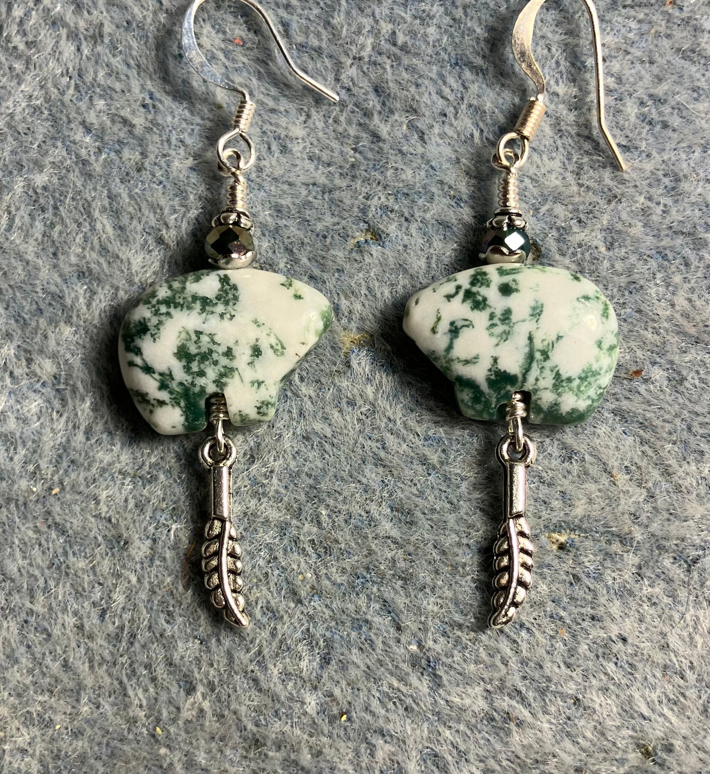 Tree agate gemstone Zuni bear fetish bear earrings adorned with dark green crystal beads and tiny silver feather charms.