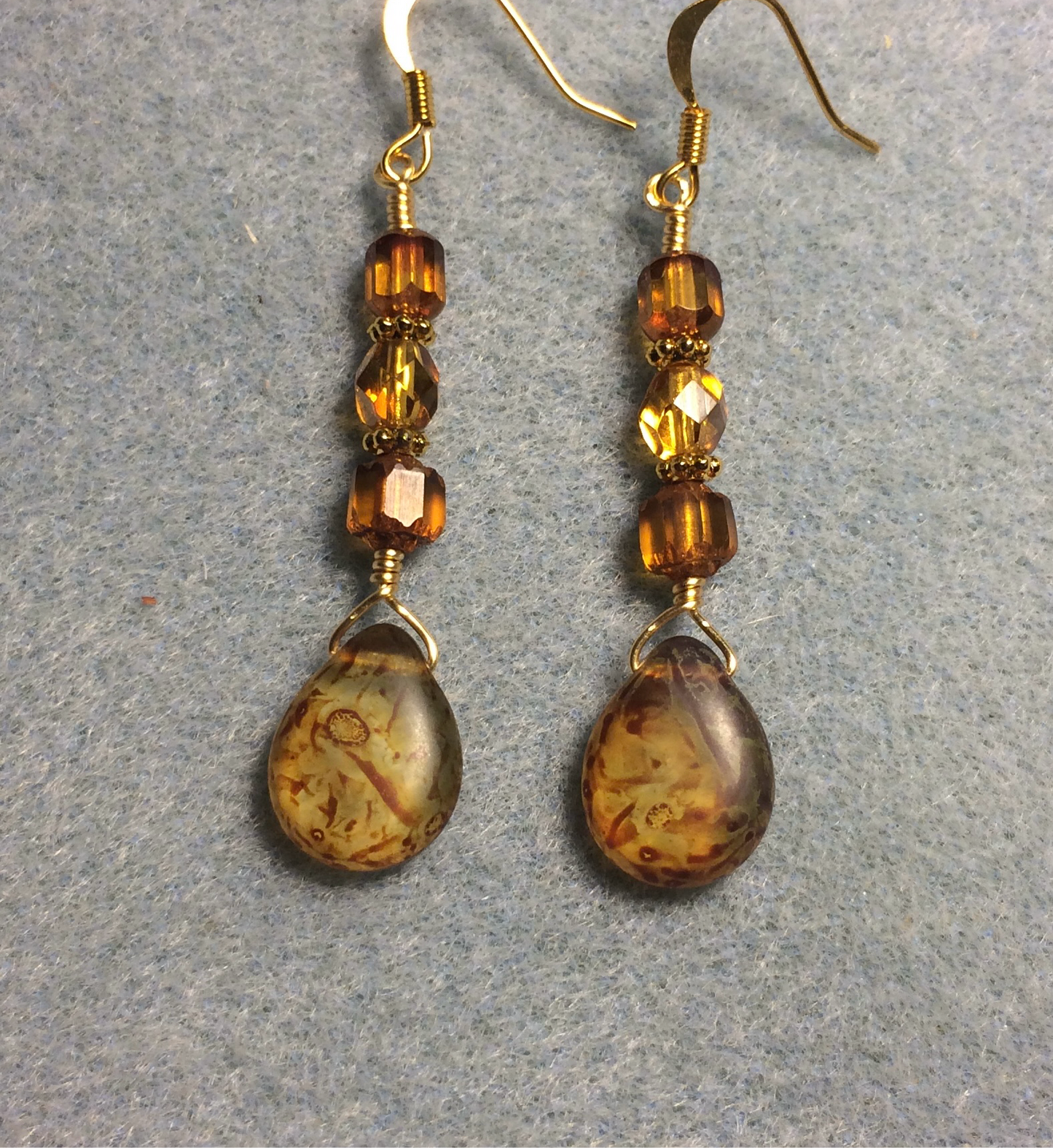 Amber brown Czech glass pear drop bead earrings adorned with dark amber Czech glass beads.