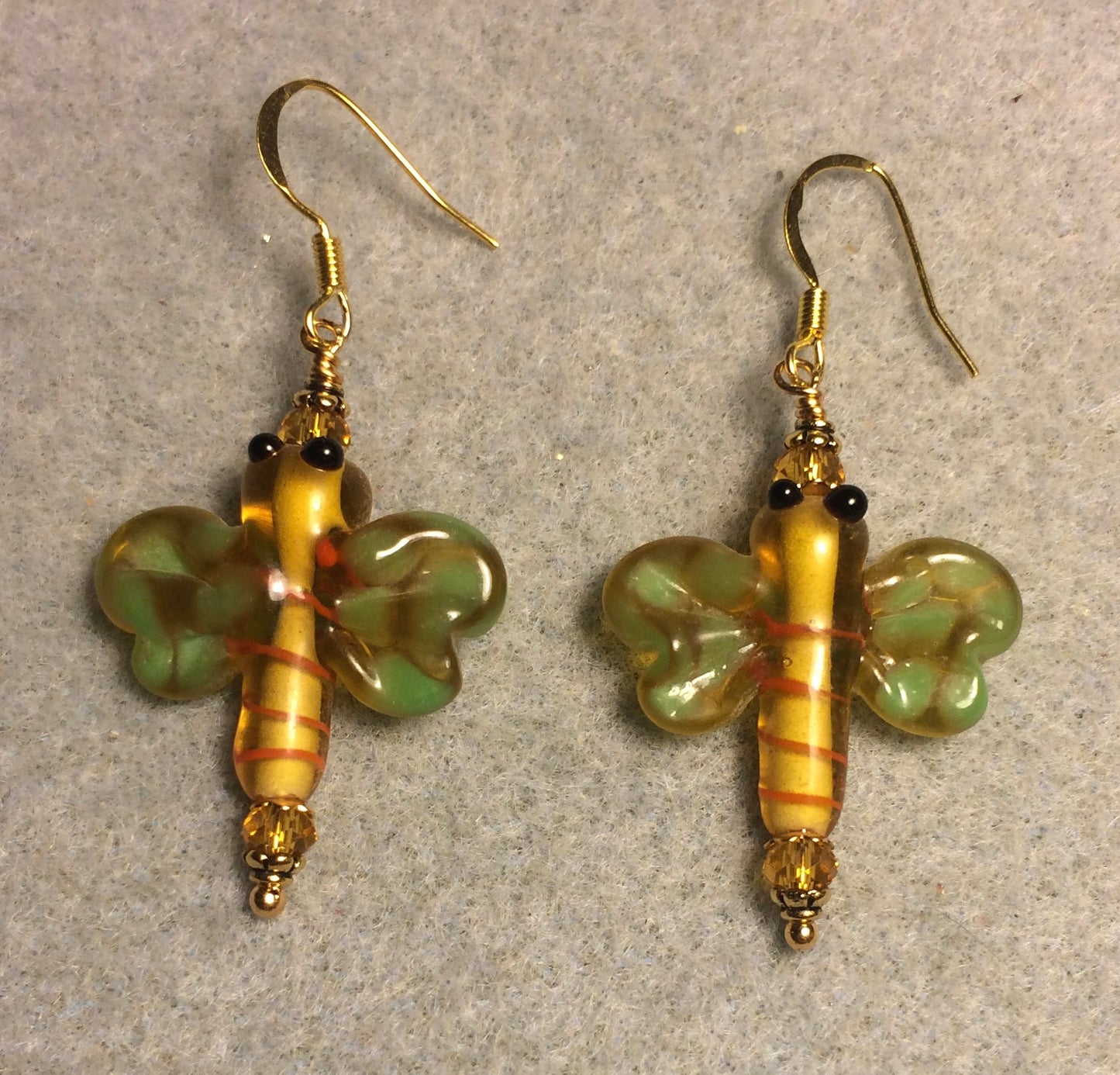 Topaz and green lamp work dragonfly bead earrings adorned with topaz Chinese crystal beads.