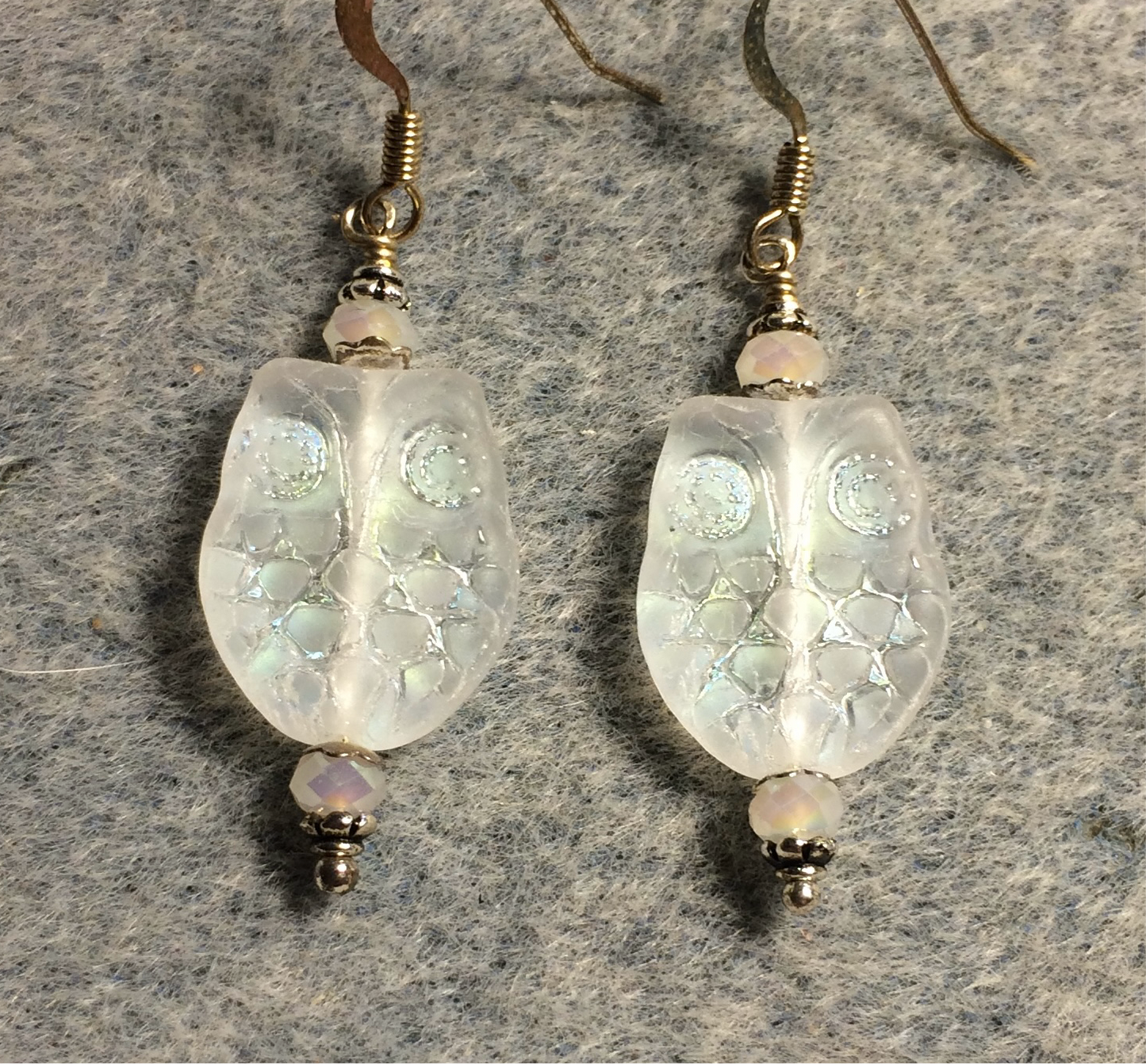 Sparkly clear Czech glass owl bead earrings adorned with iridescent clear Chinese crystal beads.