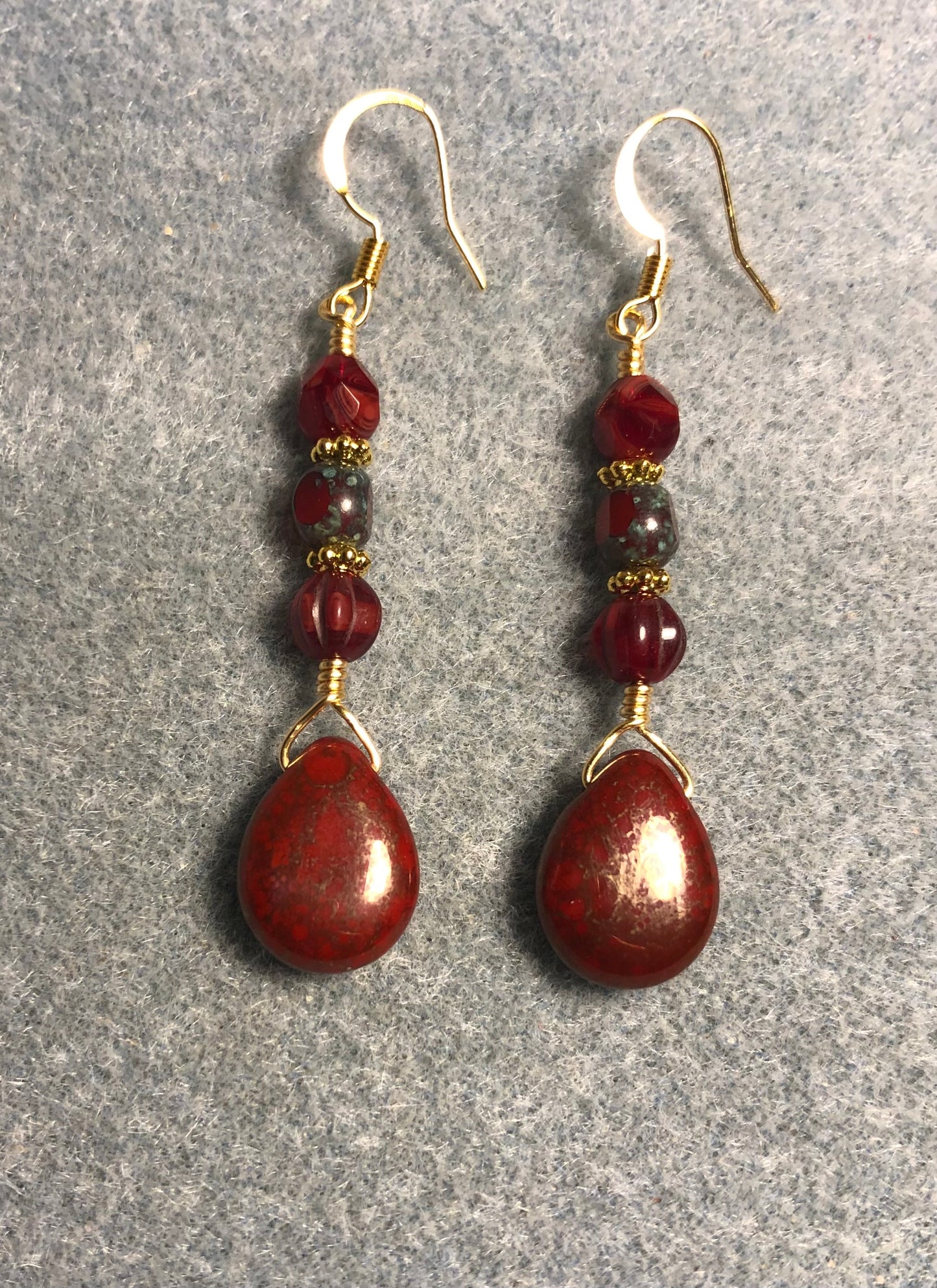 Bright red Czech glass pear drop bead earrings adorned with red Picasso Czech glass beads.