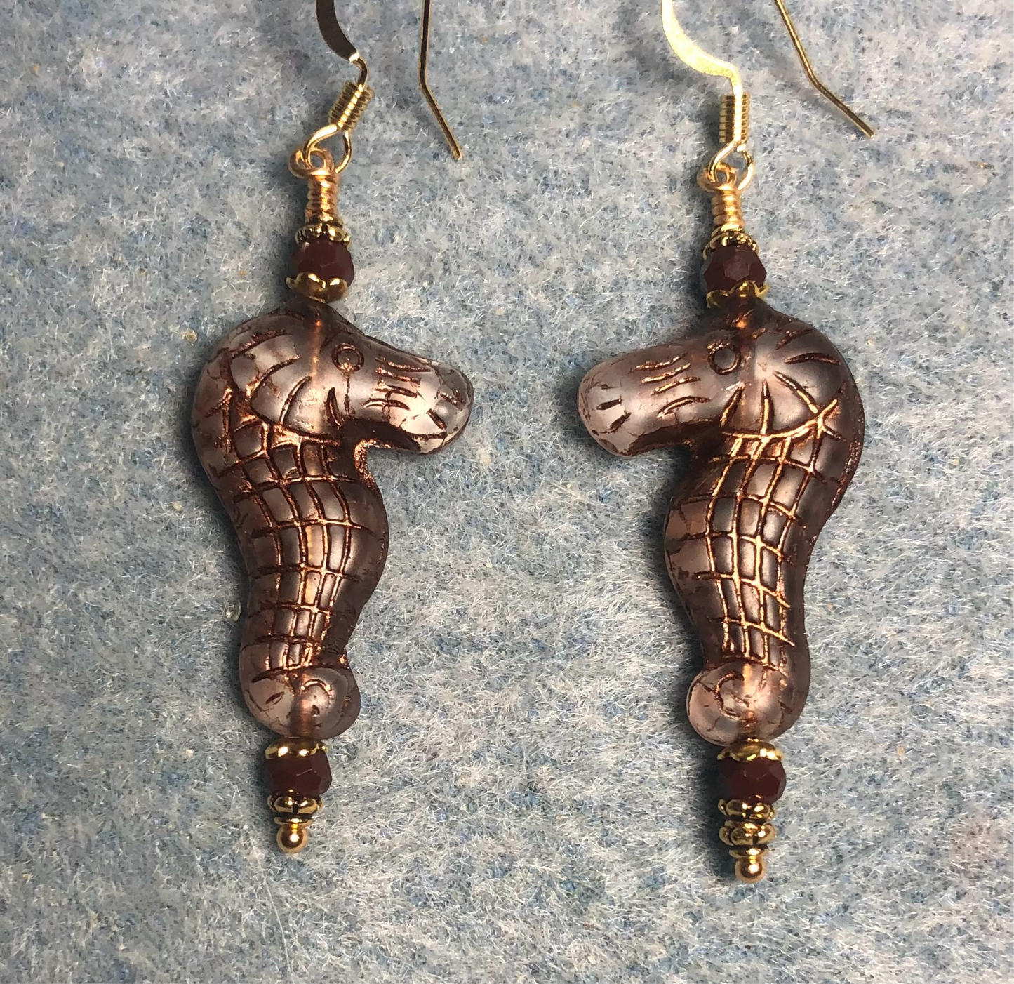 Tan (with brown inlay) Czech glass seahorse bead earrings adorned with brown Chinese crystal beads.