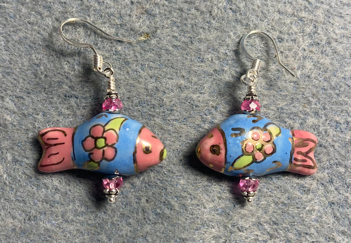 Blue and pink ceramic fish bead earrings adorned with pink Chinese crystal beads.