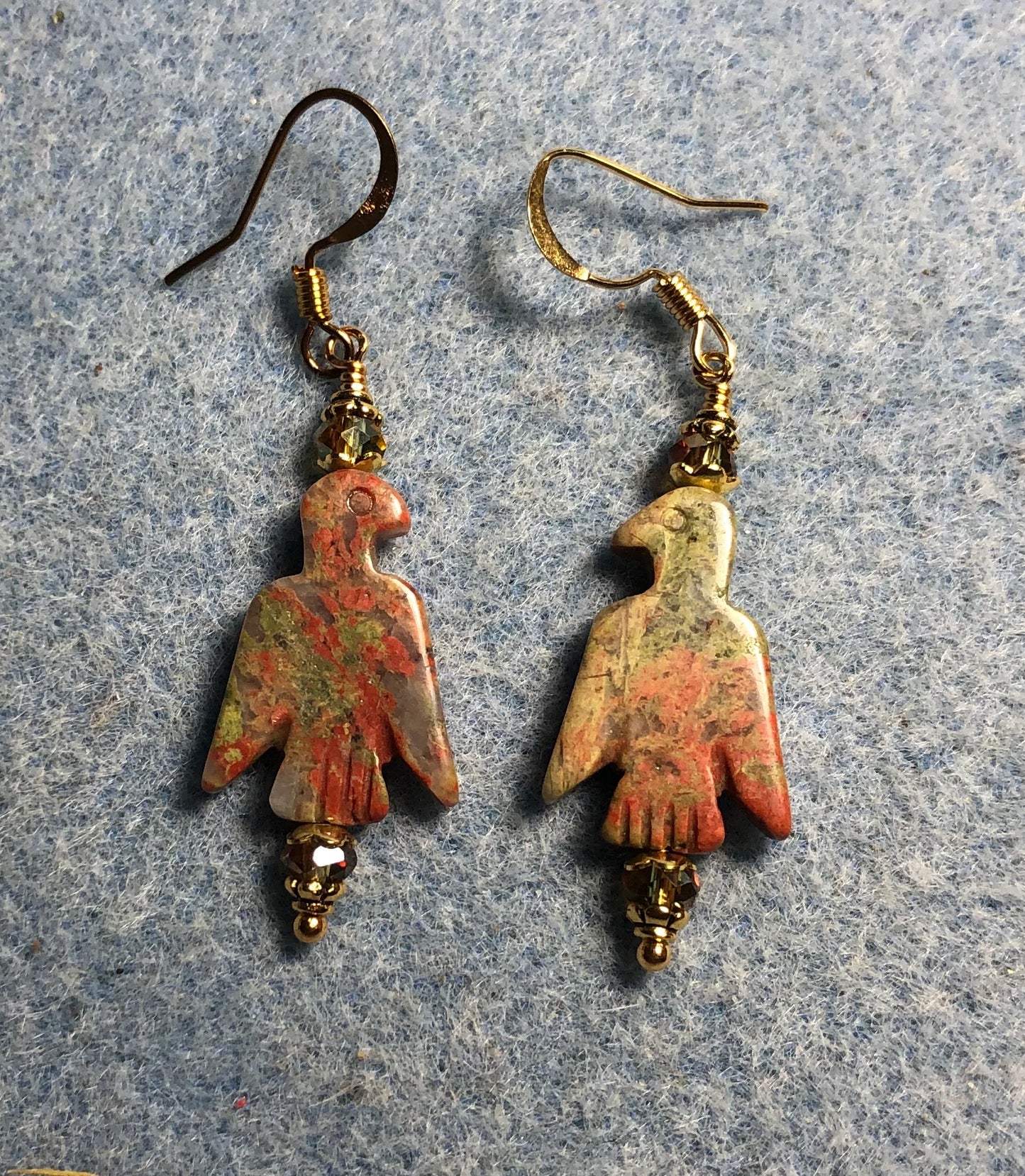 Orange and green unakite gemstone eagle bead earrings adorned with sparkly green Chinese crystal beads.