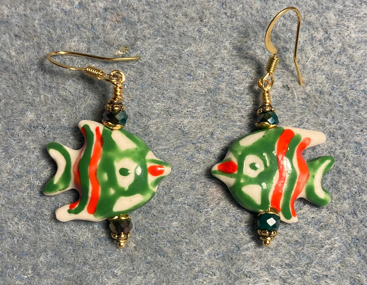 Green and orange ceramic angelfish bead earrings adorned with green Chinese crystal beads.