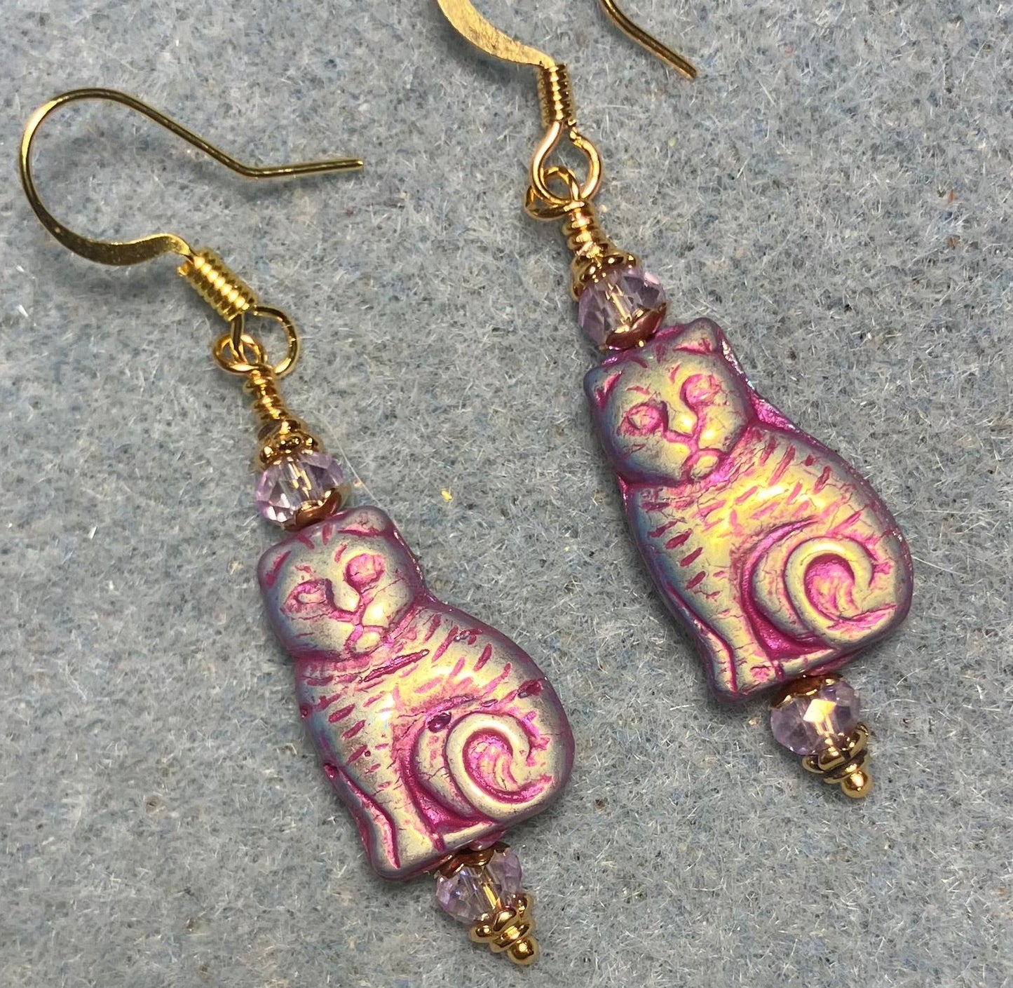 Medium metallic violet Czech glass cat bead earrings adorned with violet Chinese crystal beads.