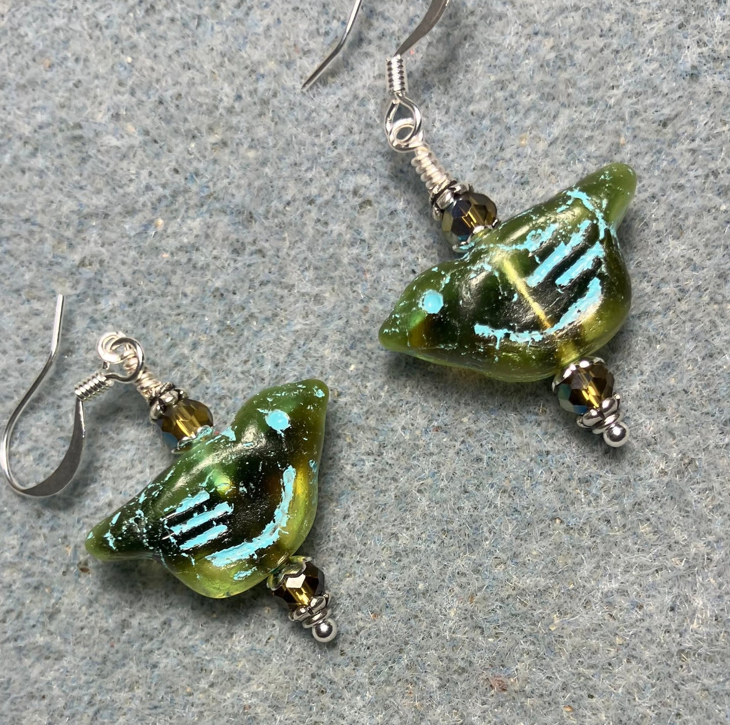 Olive green (with turquoise inlay) Czech glass bird bead earrings adorned with olive green Chinese crystal beads.