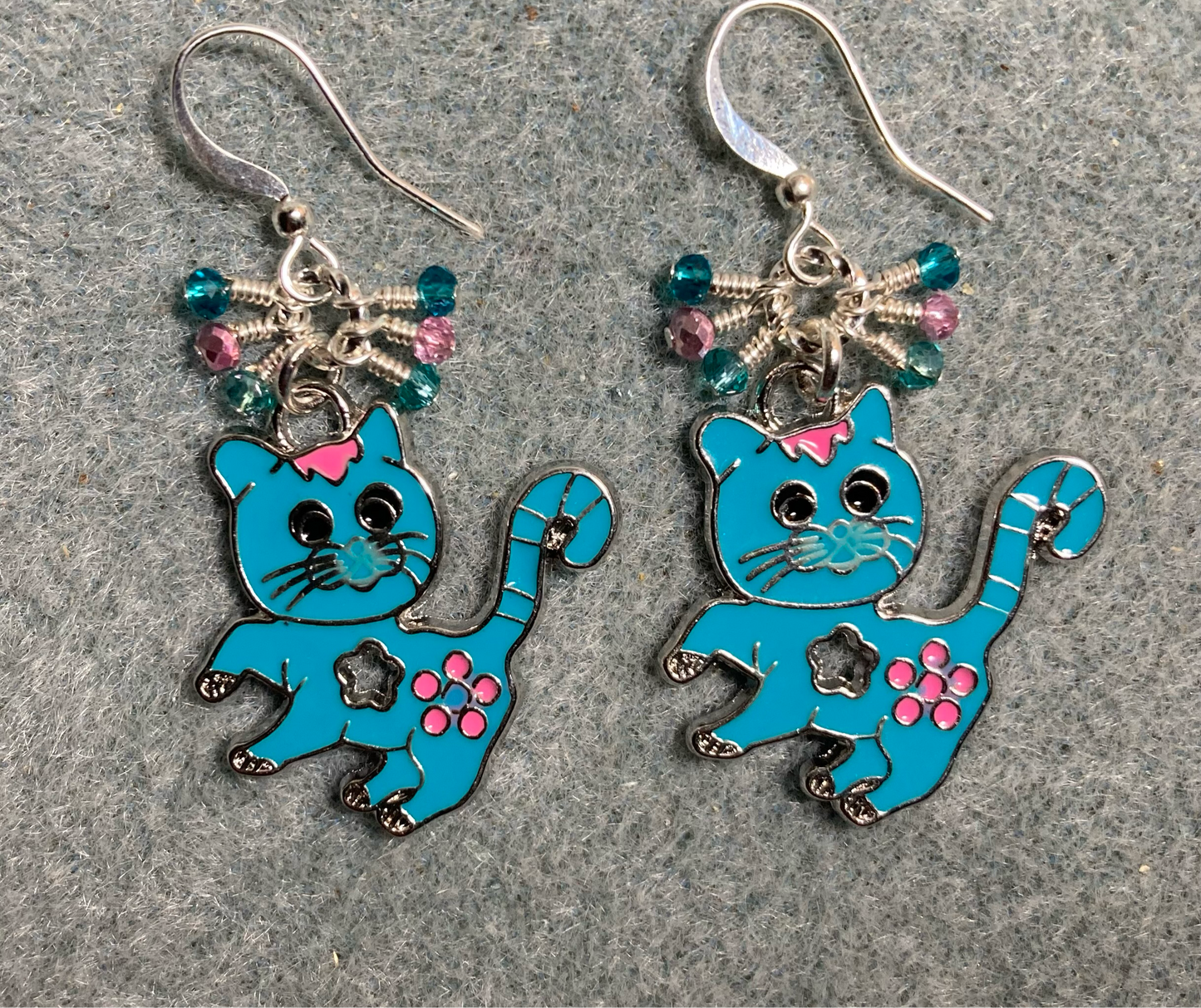 Turquoise and pink enamel cat charm earrings adorned with tiny dangling turquoise and pink Chinese crystal beads.