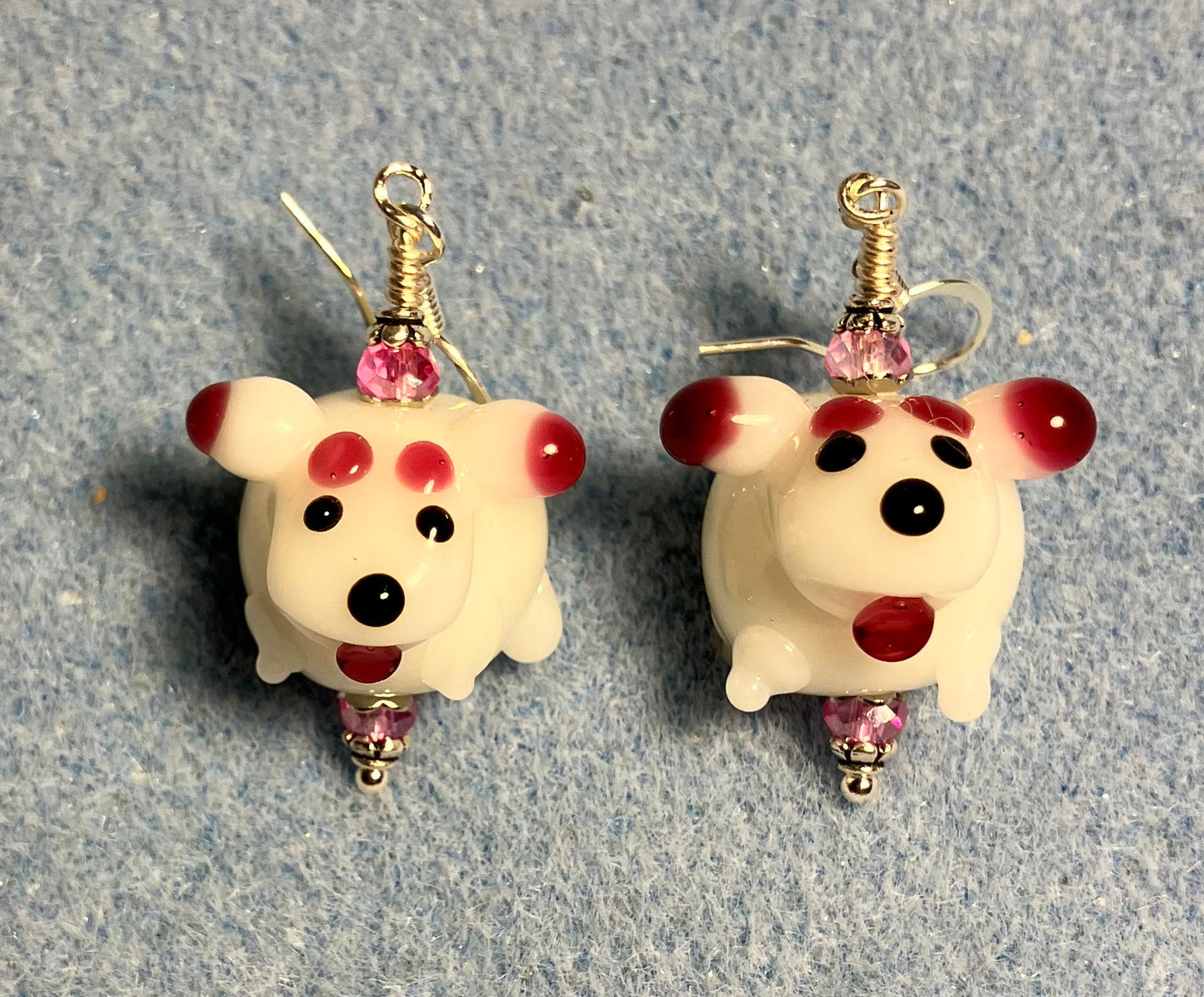 White and hot pink lamp work sheep bead earrings adorned with hot pink Chinese crystal beads.