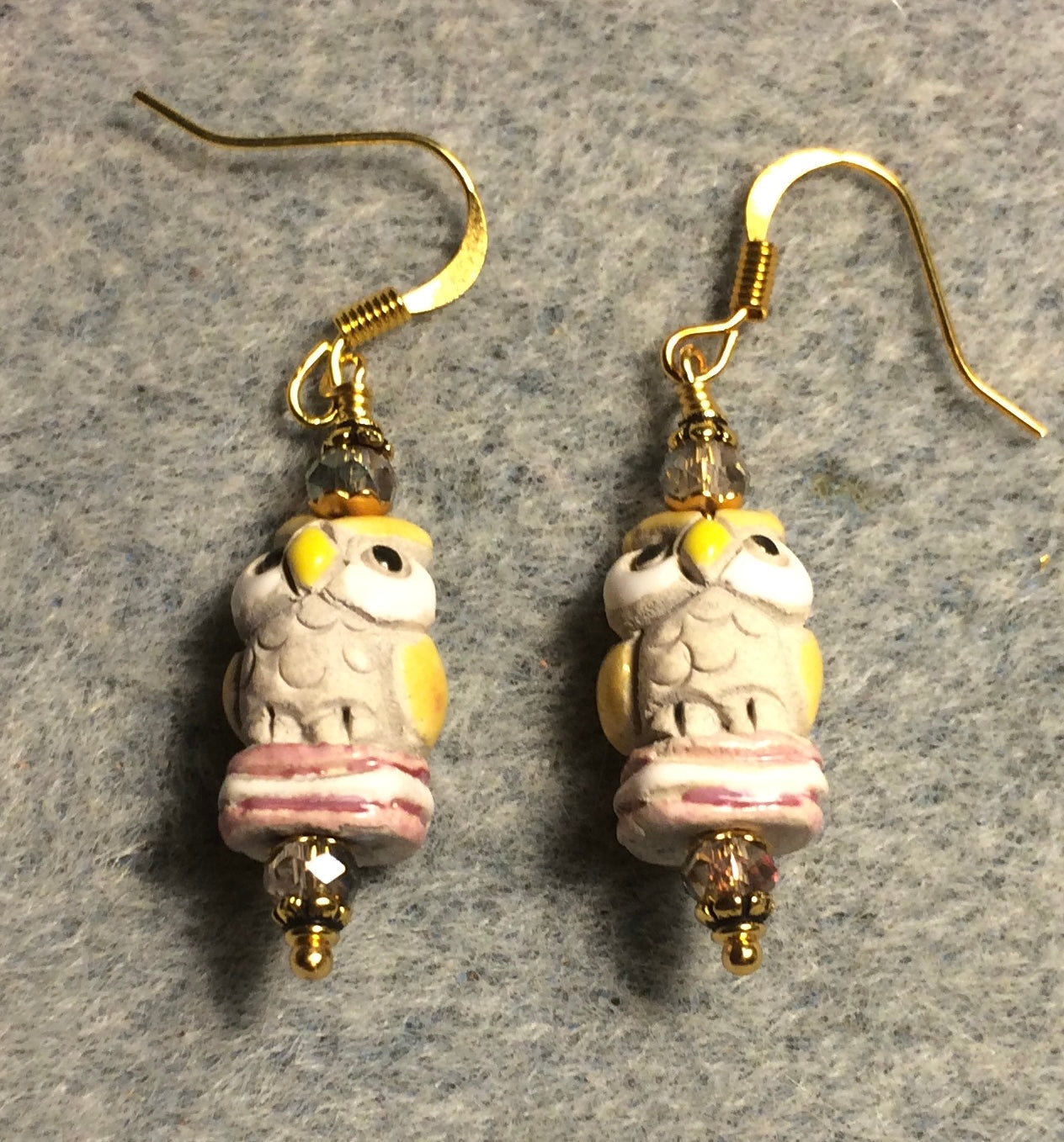 Small pink and yellow ceramic owl bead earrings adorned with pink Chinese crystal beads.