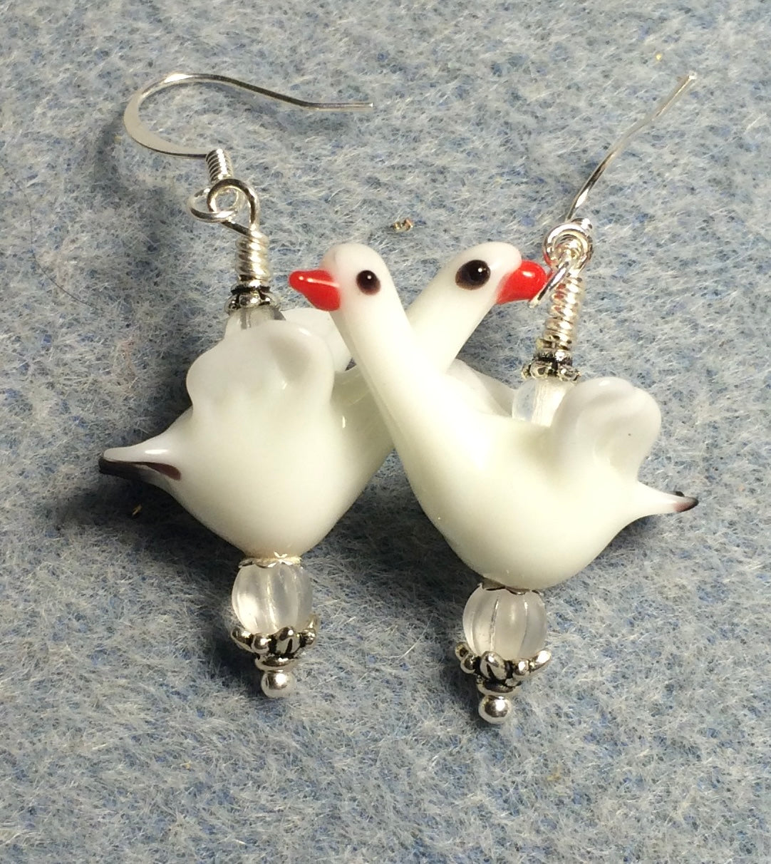 White long necked lamp work swan bead earrings adorned with clear Czech glass beads.
