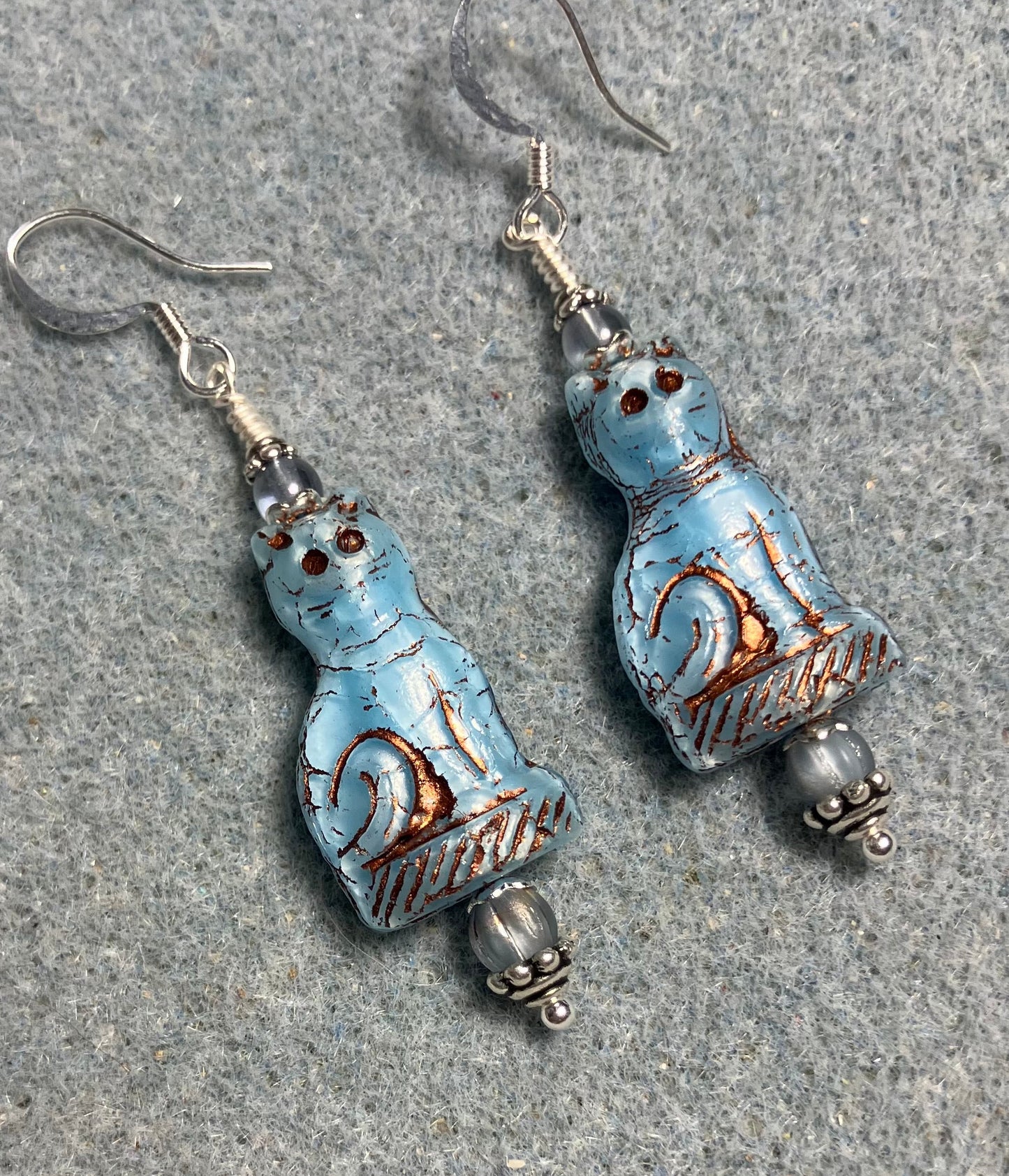 Opaque light blue (with copper inlay) fancy Czech glass cat bead earrings adorned with light blue Czech glass beads.