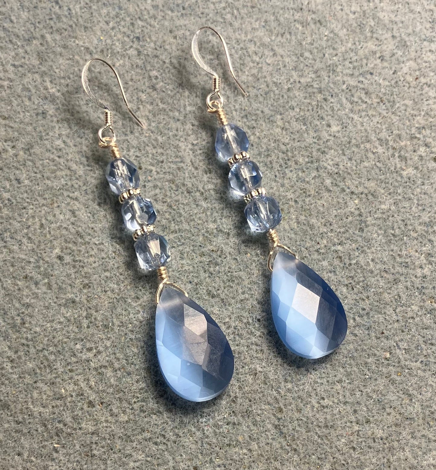 Light blue fiber optic briolette bead earrings adorned with light blue Czech glass beads.